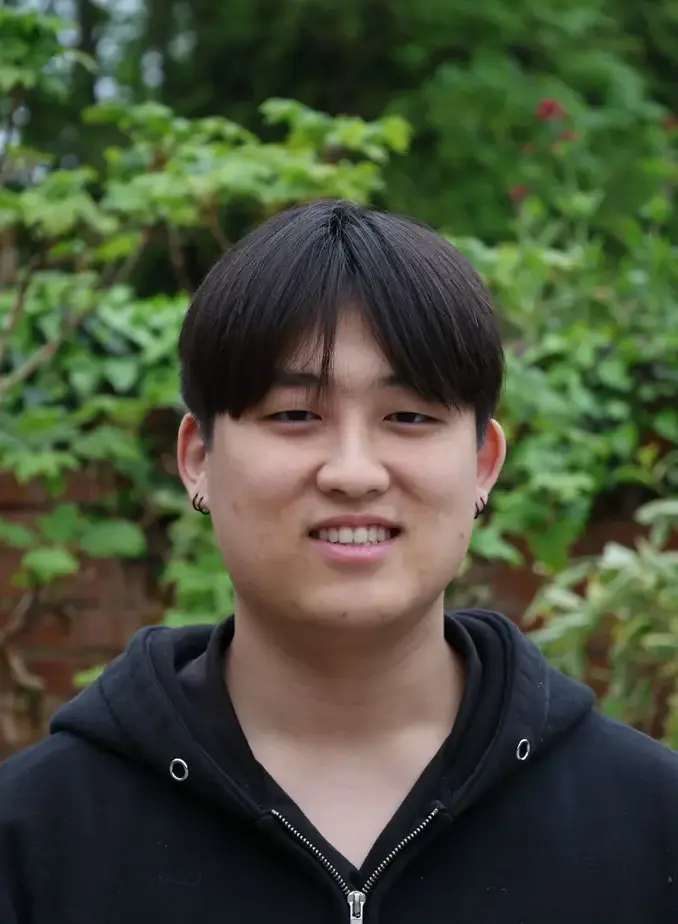 Male student from South Korea smiling at camera