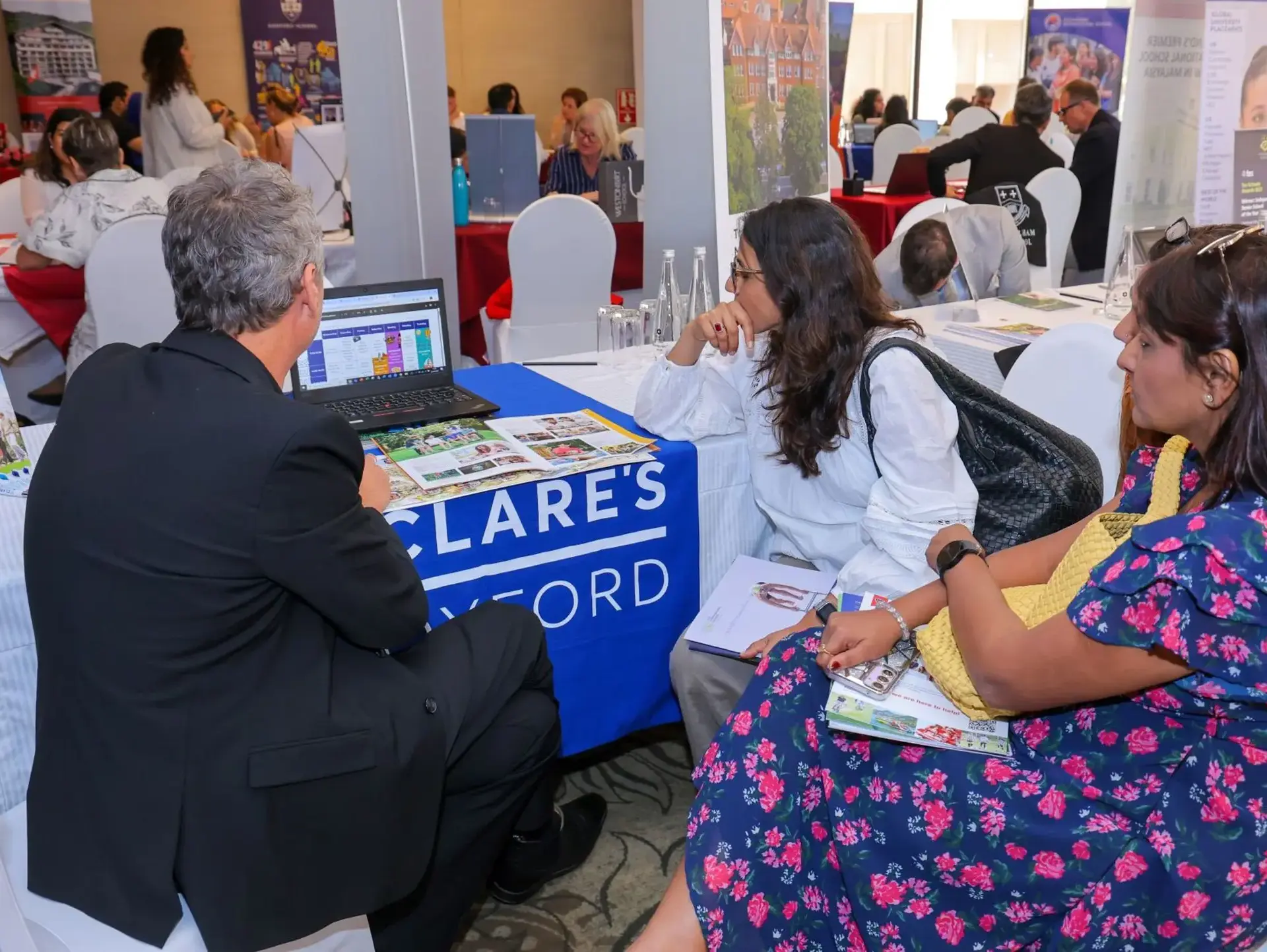Event guests sitting at St Clare's table