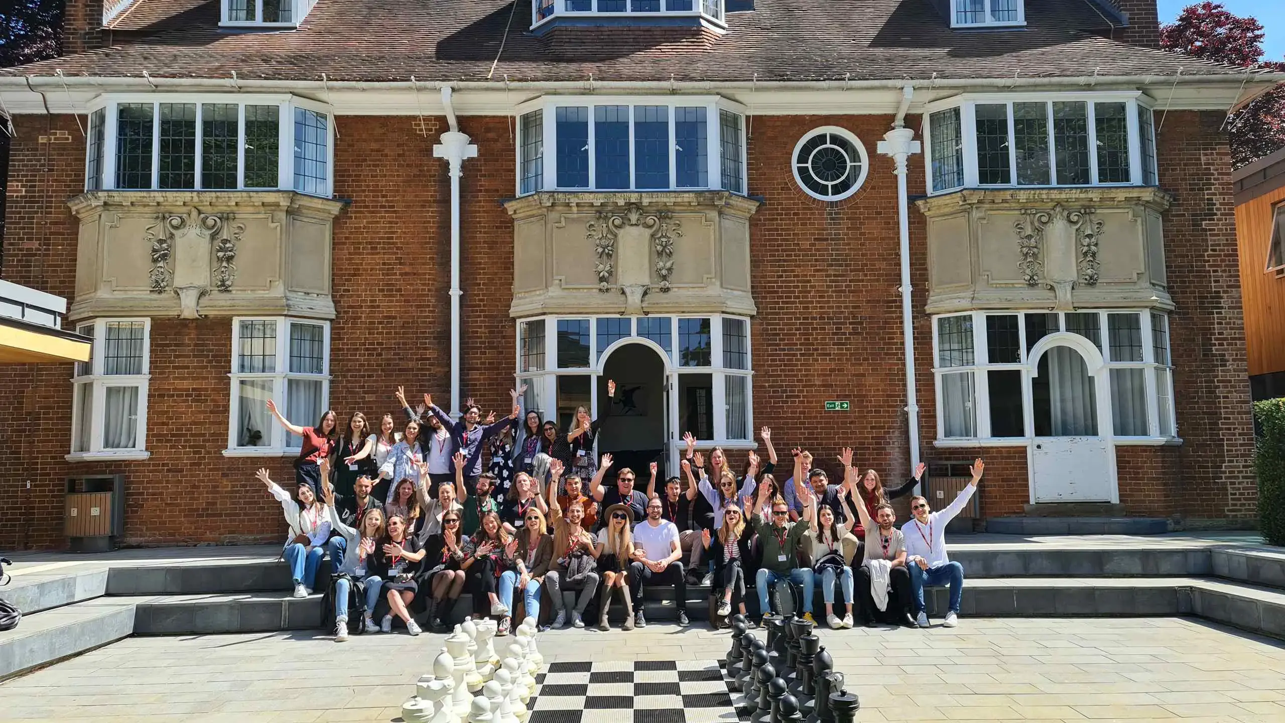 Large group of students in front of St Clare's building