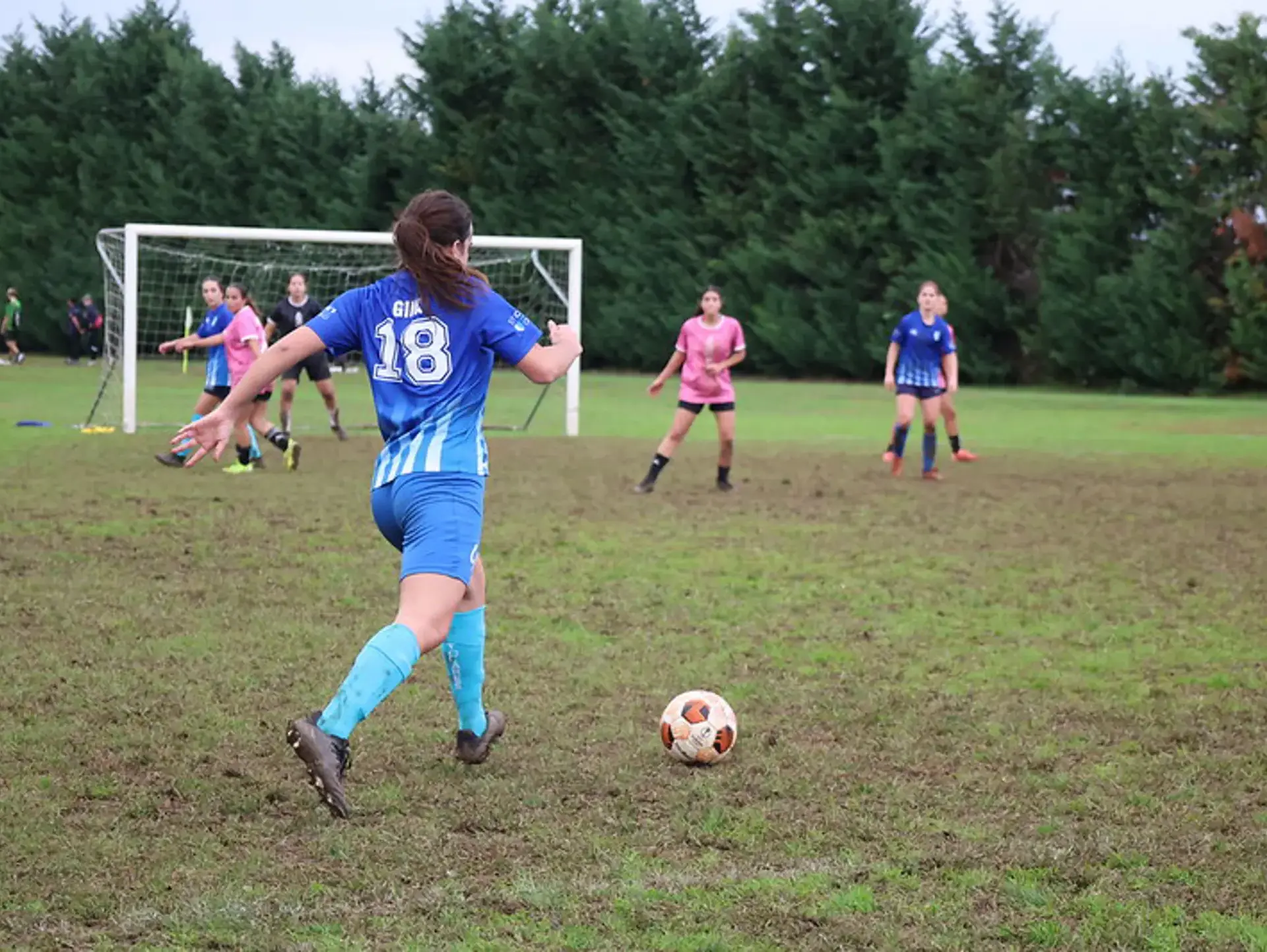 Student athlete taking free kick