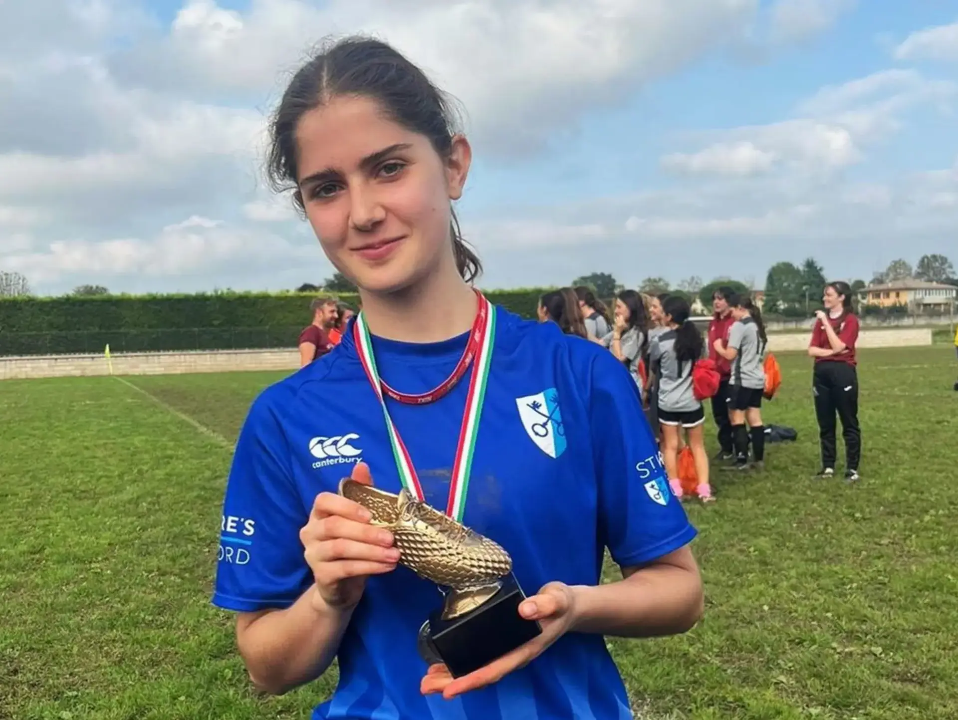 Student athlete showing off medal
