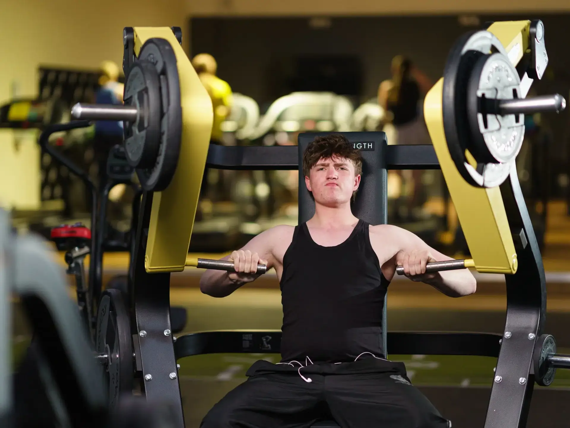 Student lifting weights