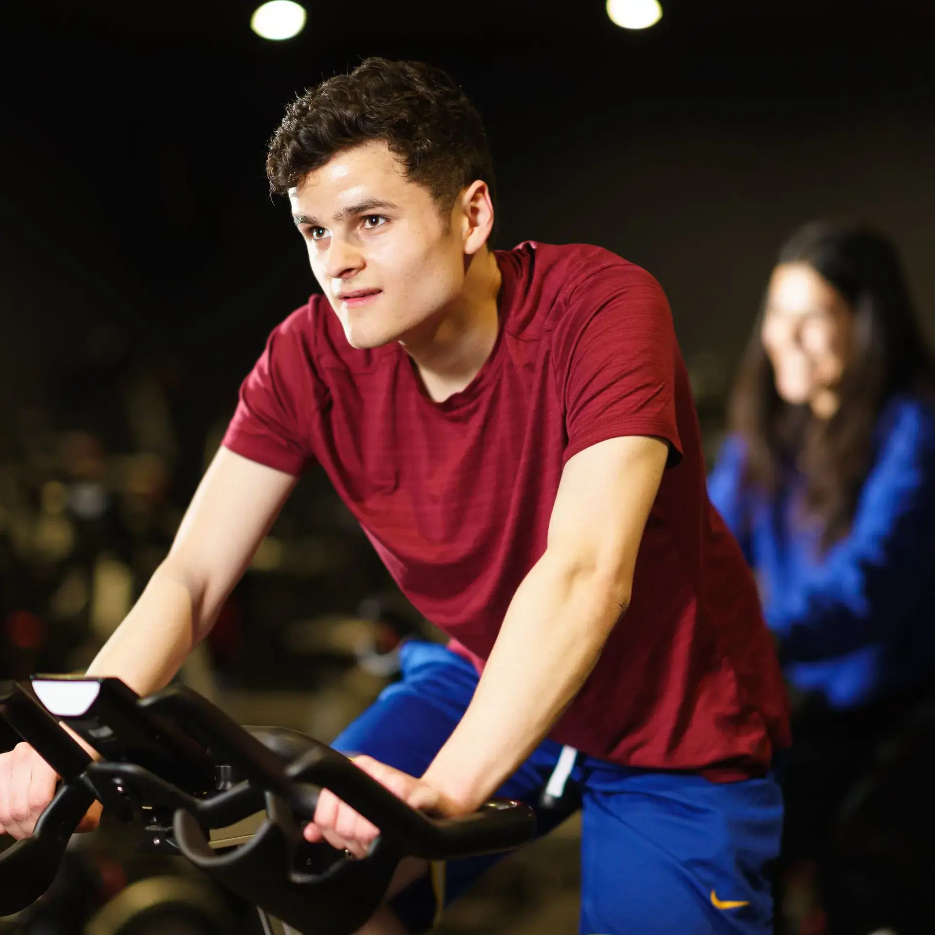 Student pedalling on exercise bike