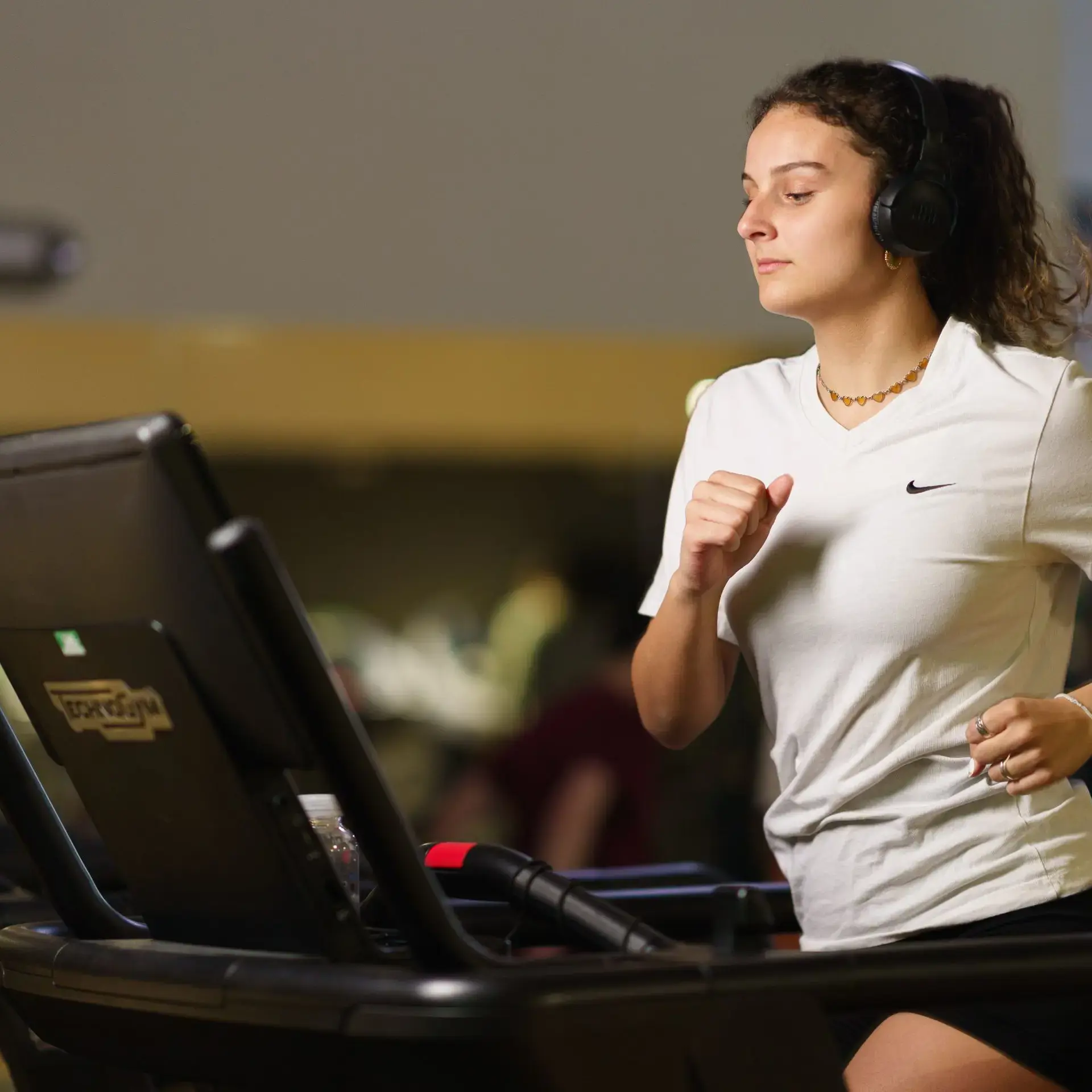 Student running on treadmill