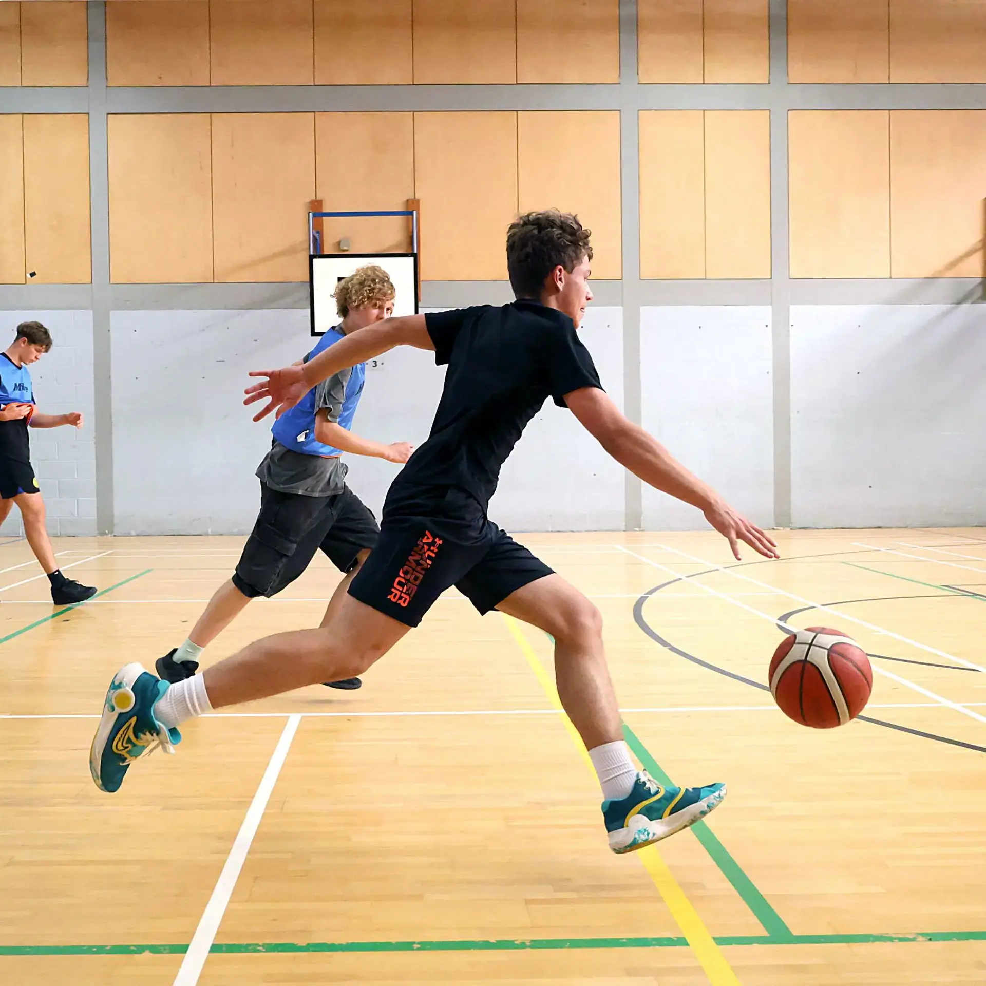 Students playing basketball