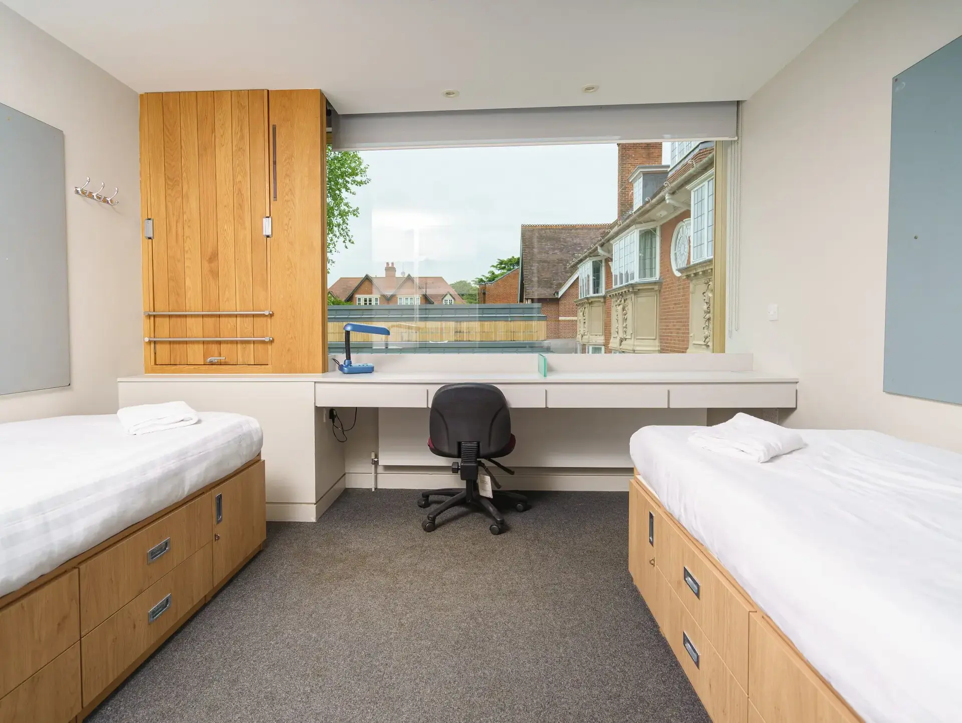 Twin bedroom with large window