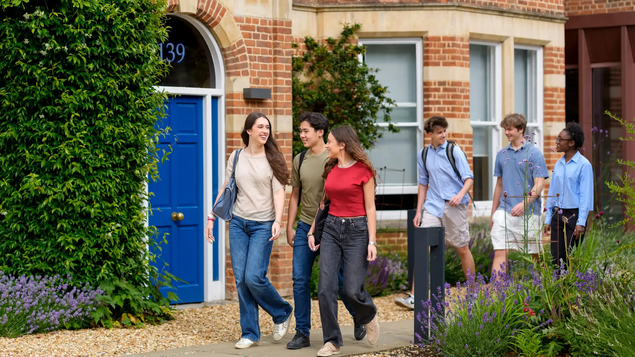 Students walking outside St Clare's building
