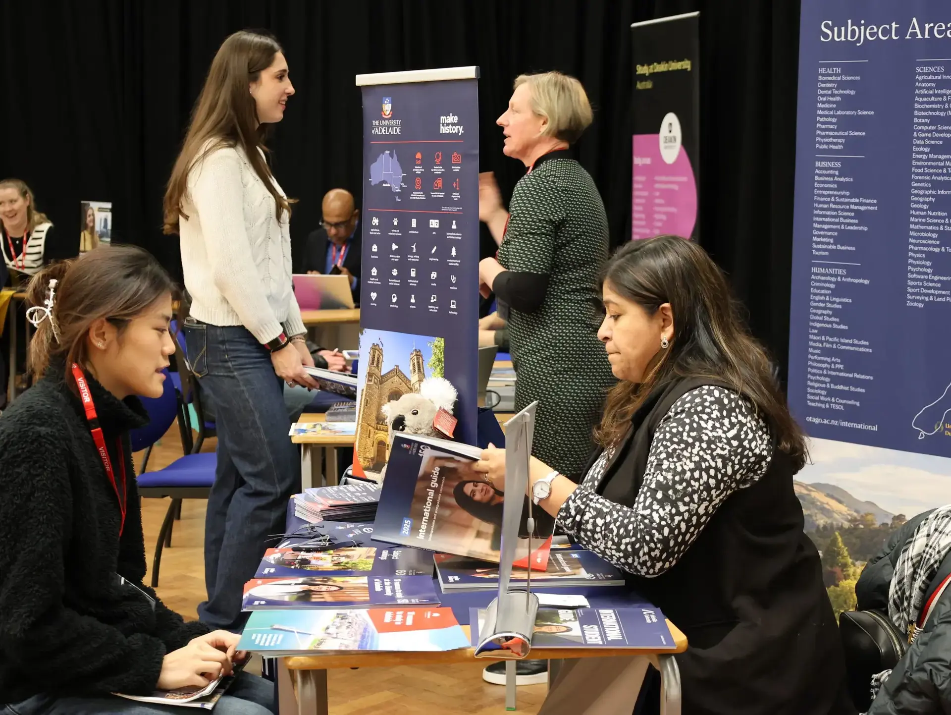 Student speaking to staff at careers fair