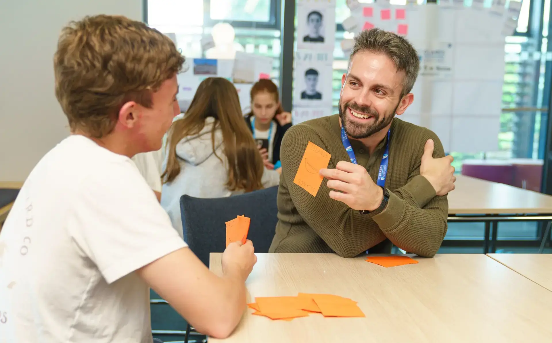 Teacher and student working with flash cards