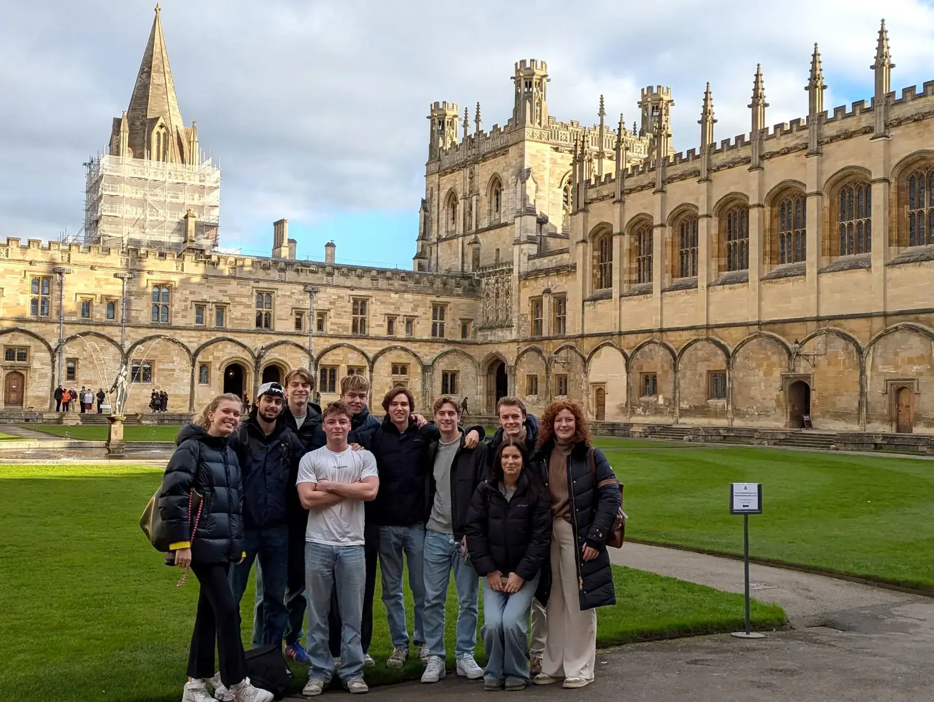 Students standing in courtyard of church building