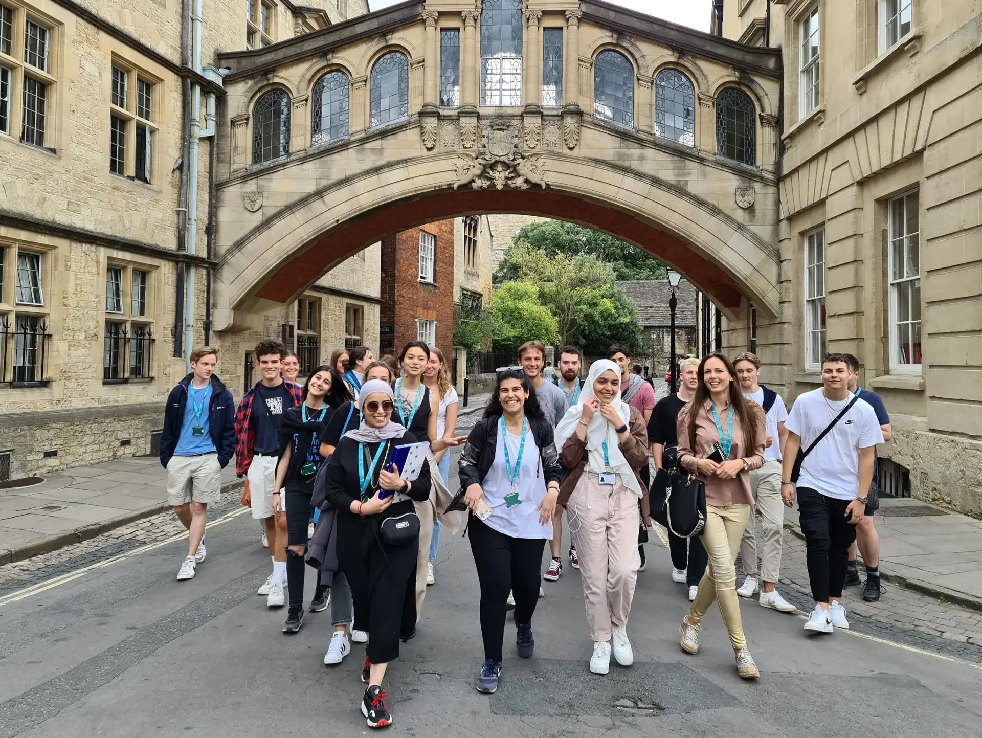 Students walking under skybridge