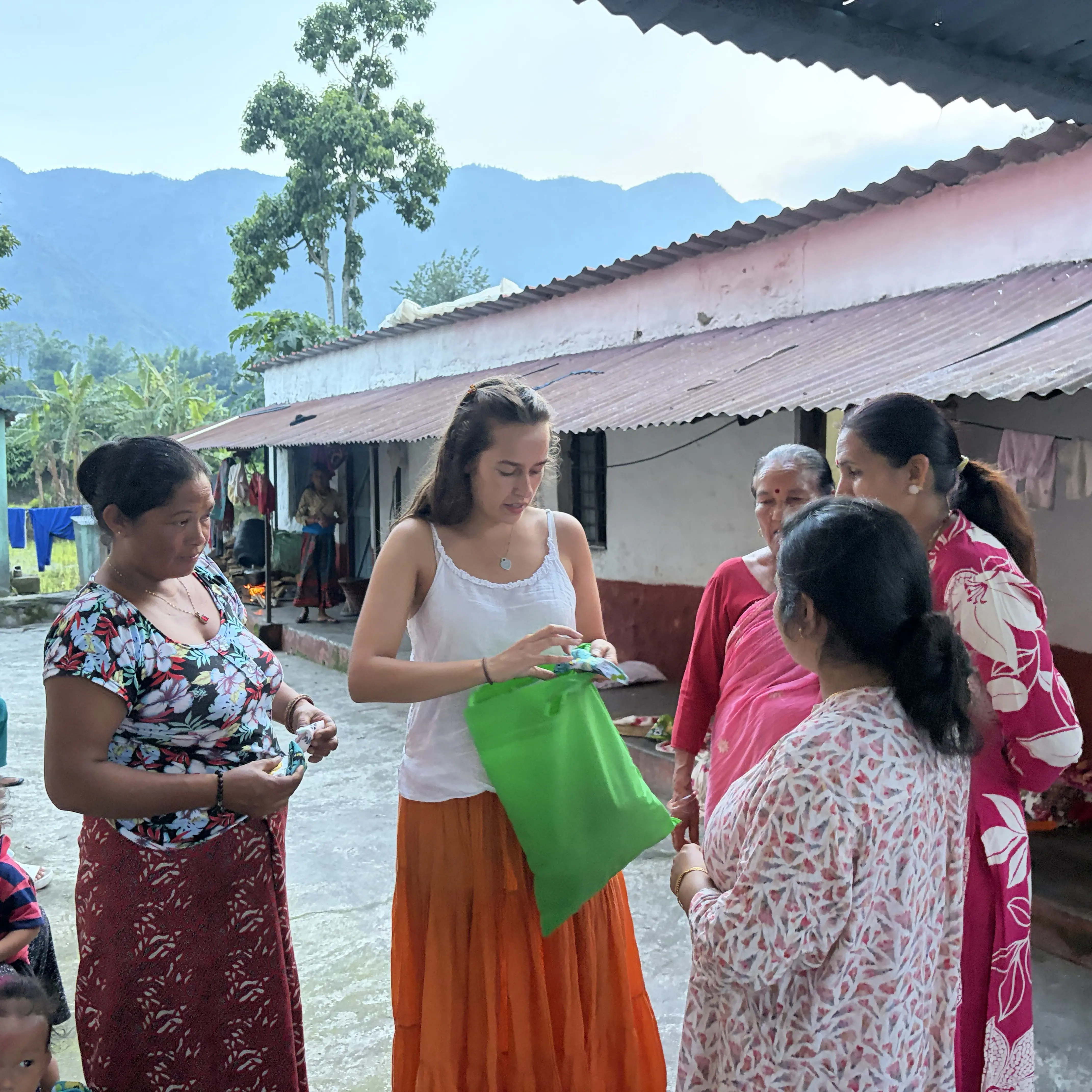 IB Alumna Emilia distributing reusable sanitary products for women and young girls in Nepal