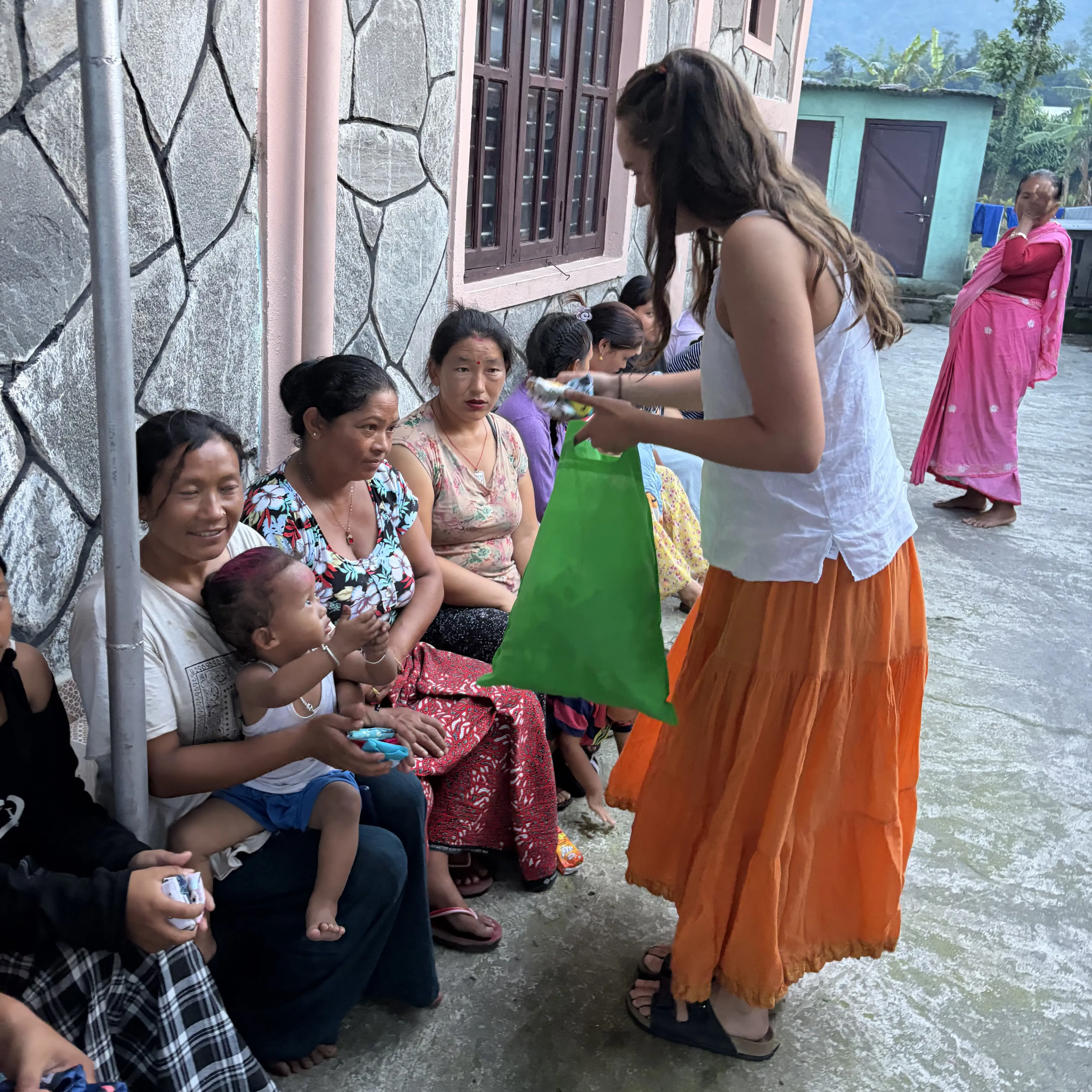 IB Alumna Emilia distributing reusable sanitary products for women and young girls in Nepal