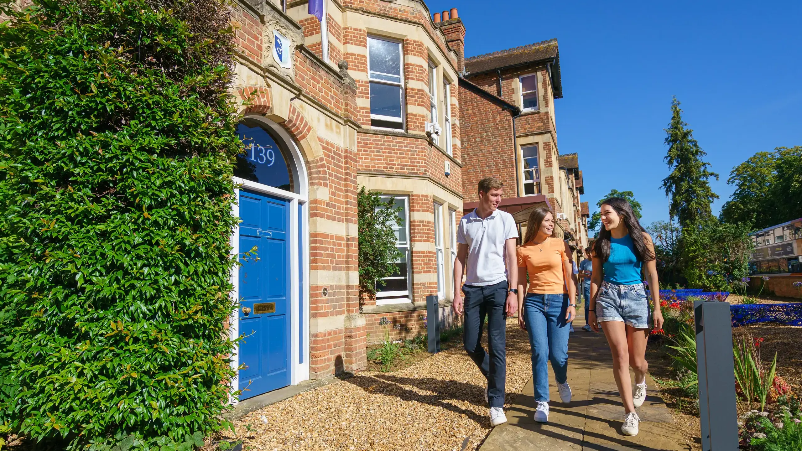 Students walking outside St Clare's building