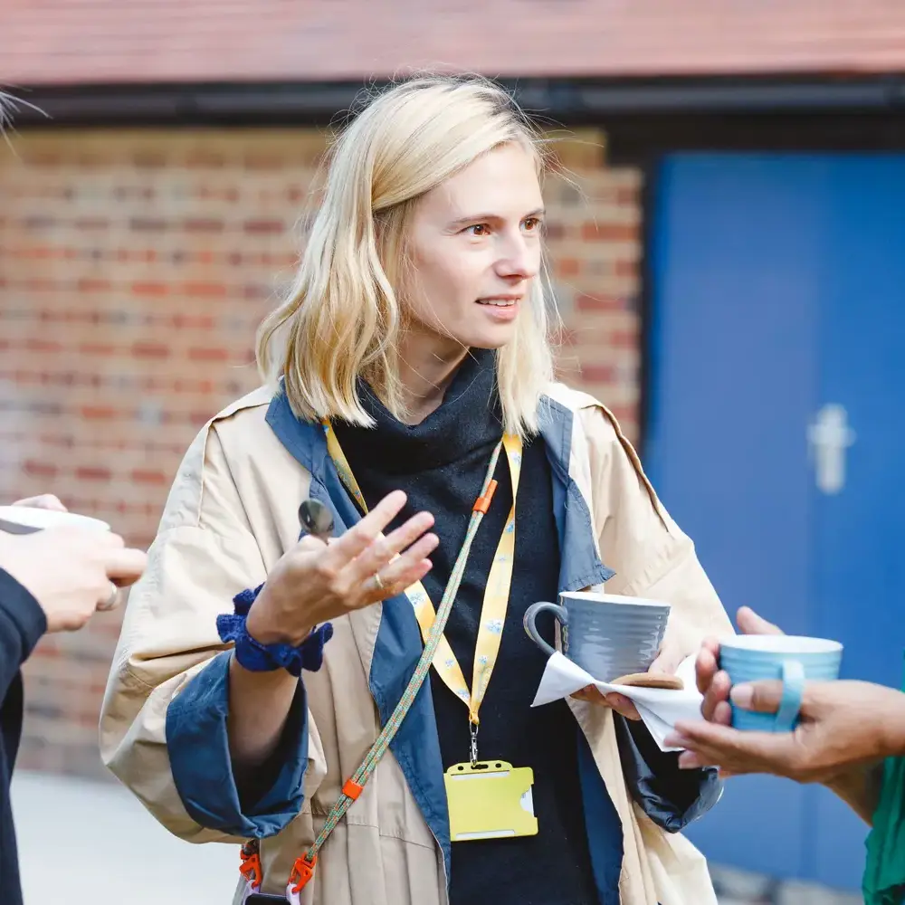 Teachers conversing together about course