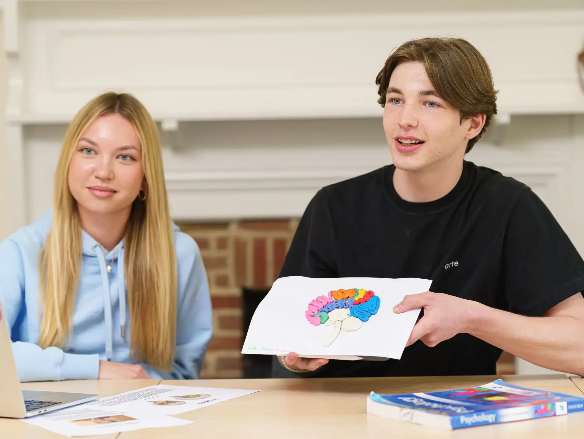 Students showing diagram of brain