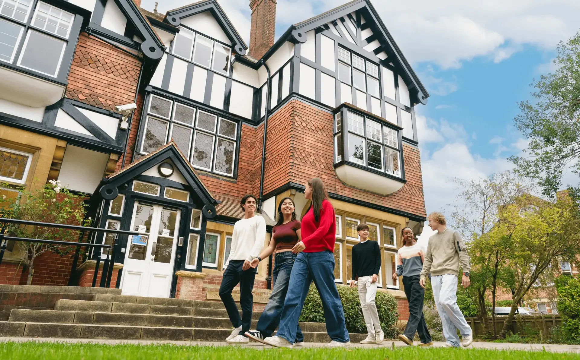Students walking outside St Clare's building