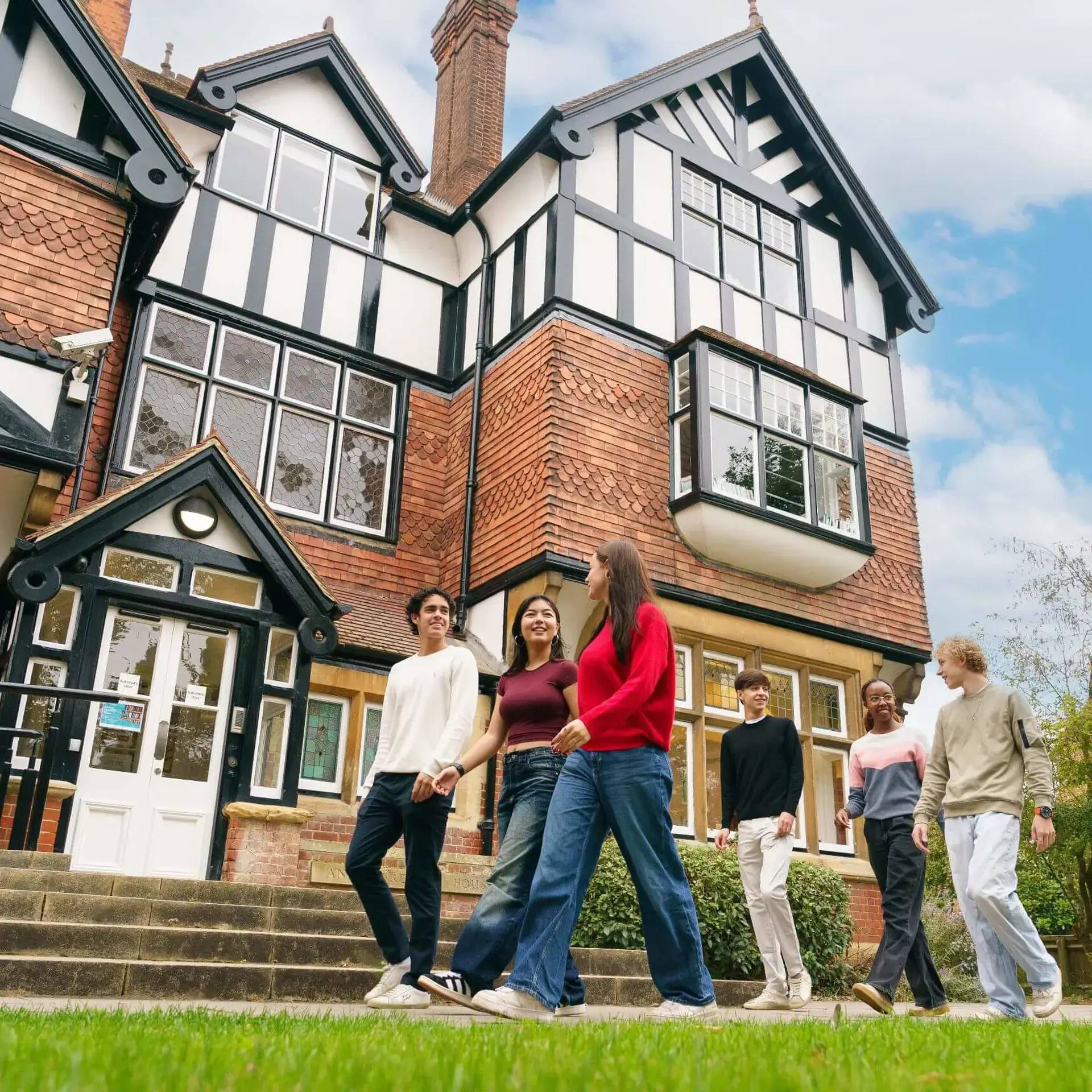 Students walking outside St Clare's building
