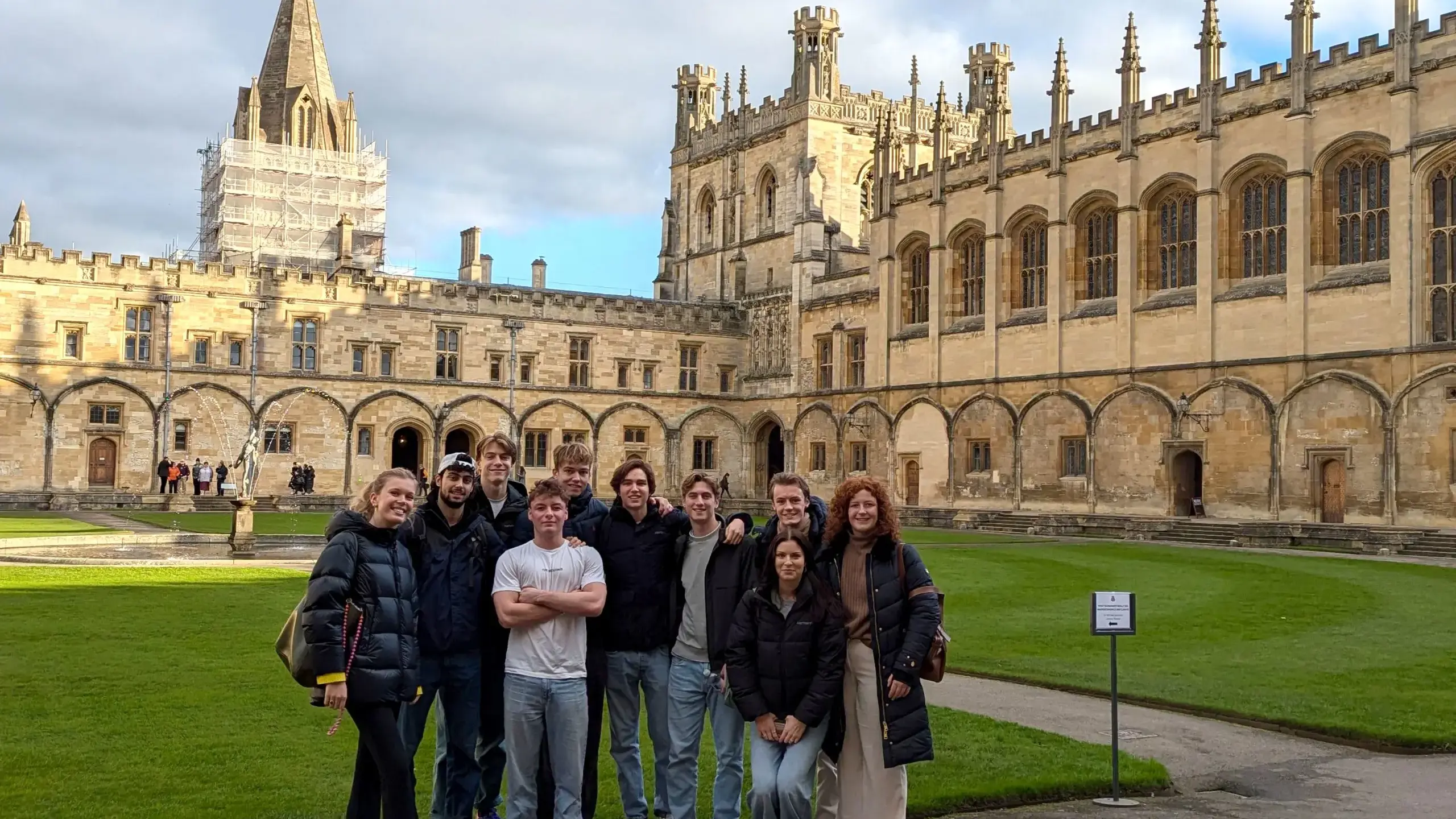 Students posing in grounds of cathedral