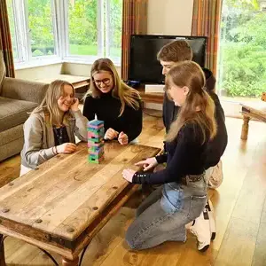 Students in boarding home talking and smiling
