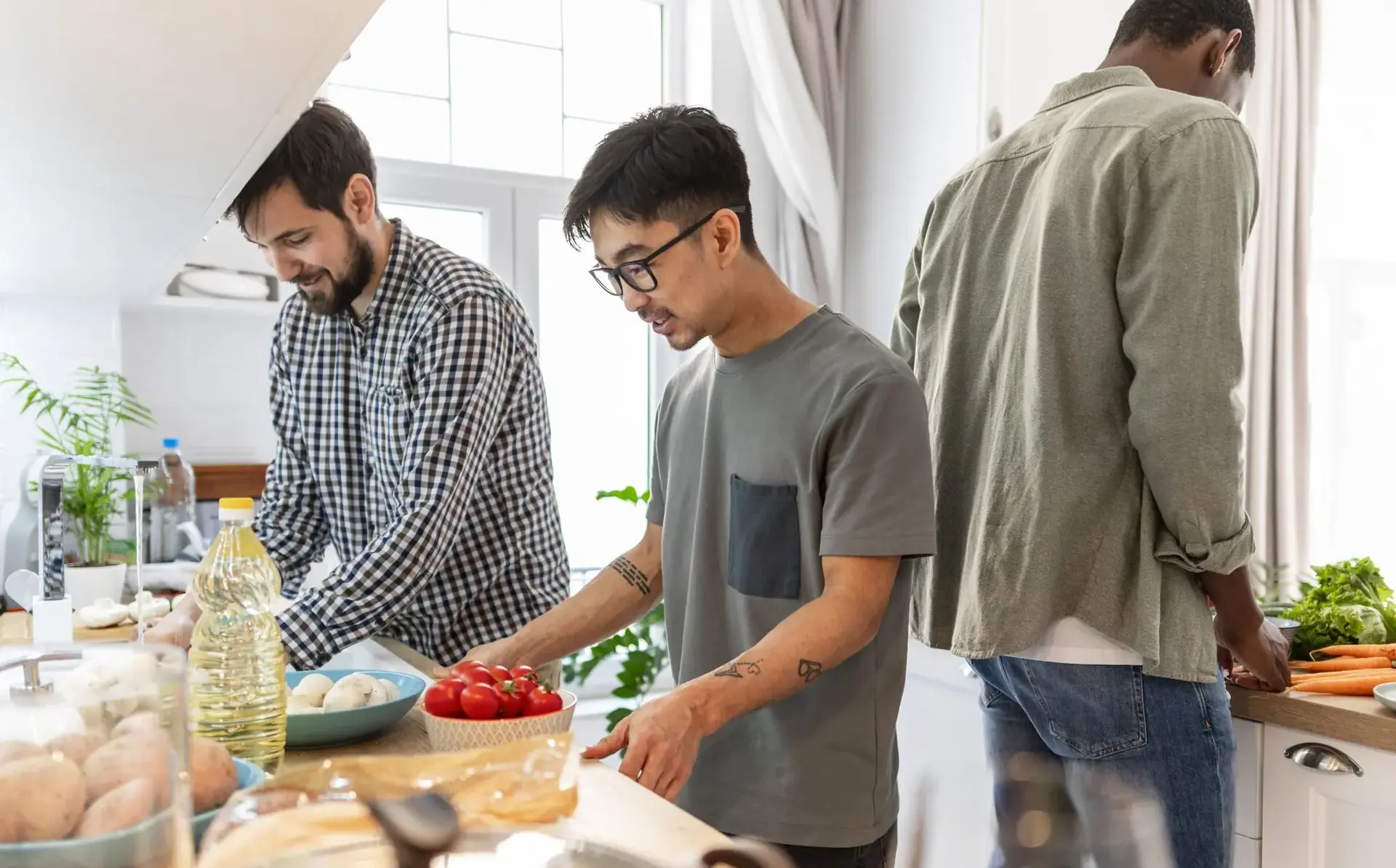 Students cooking together in kitchen