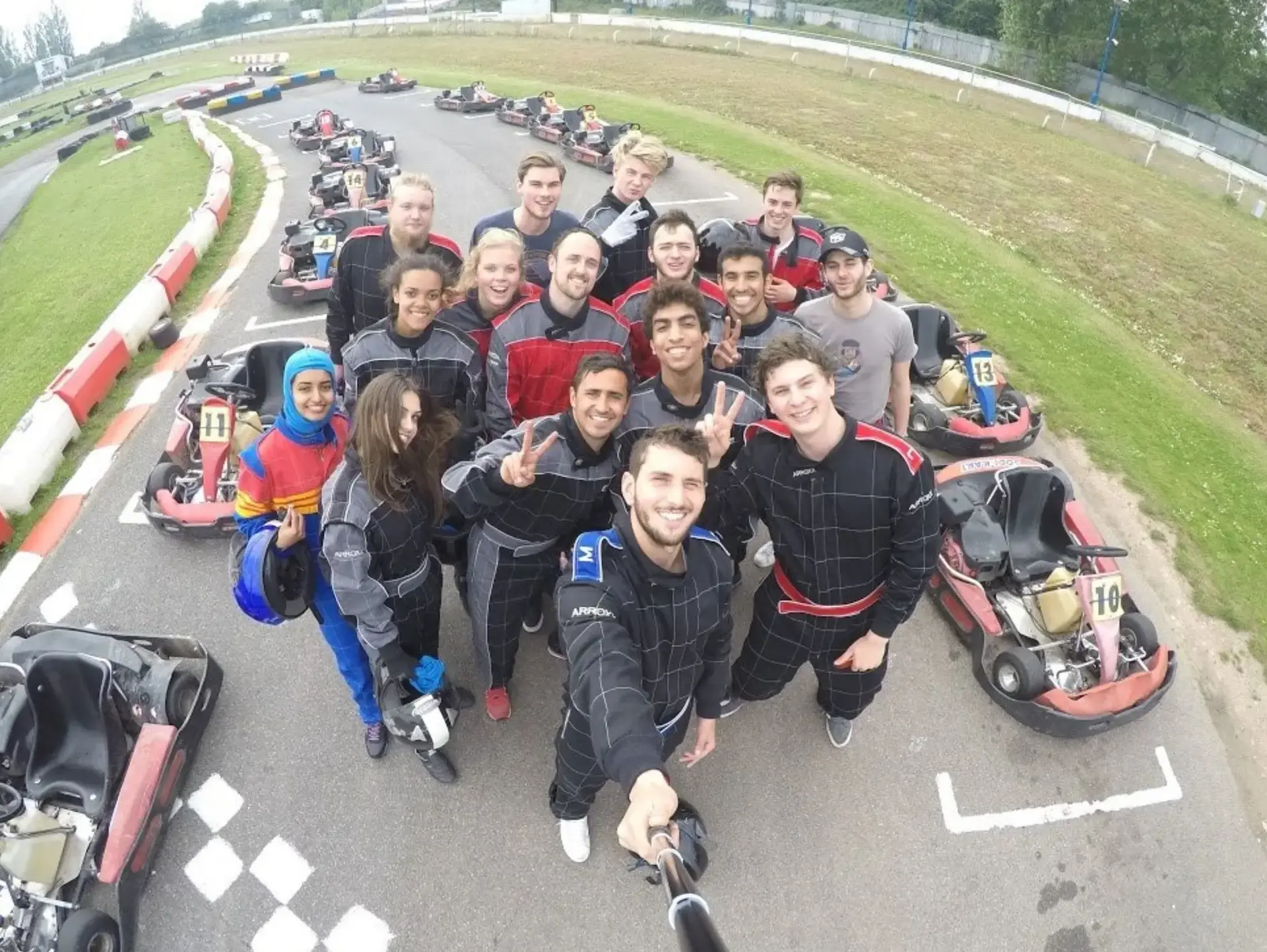 Students posing on karting track