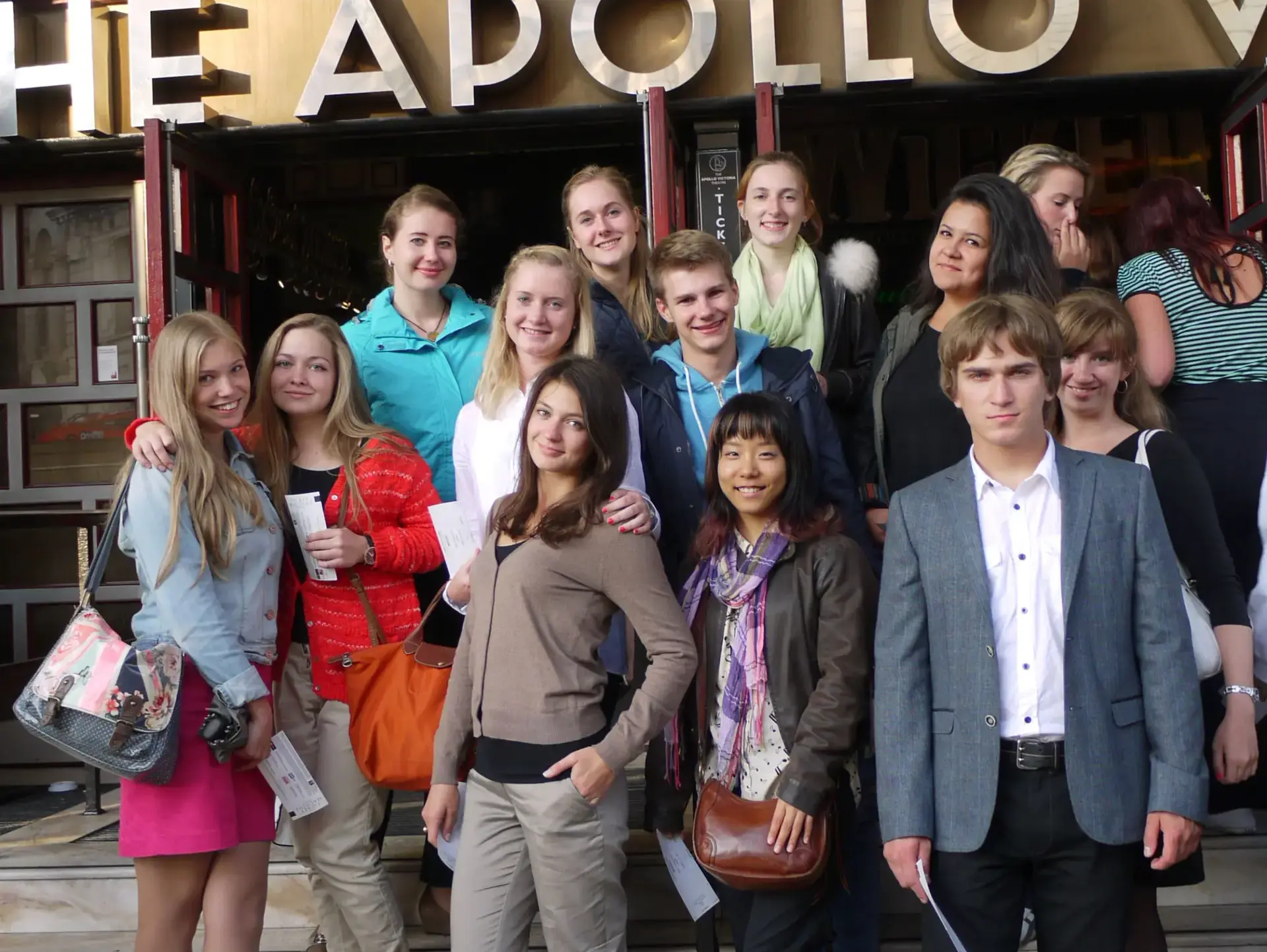 Students posing in front of The Apollo