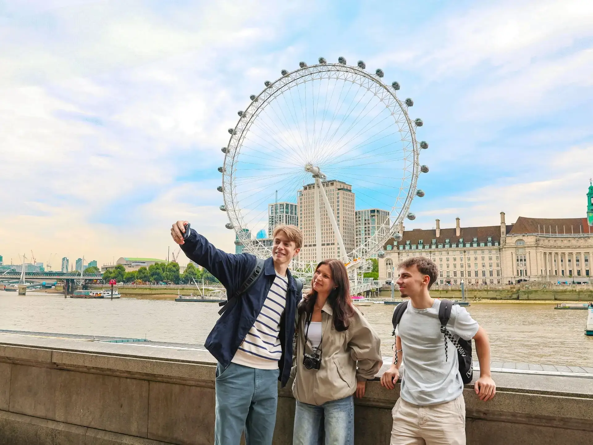 Students taking selfie in front of London Eye