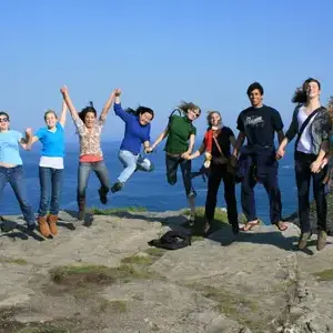 Students jumping in air on class trip