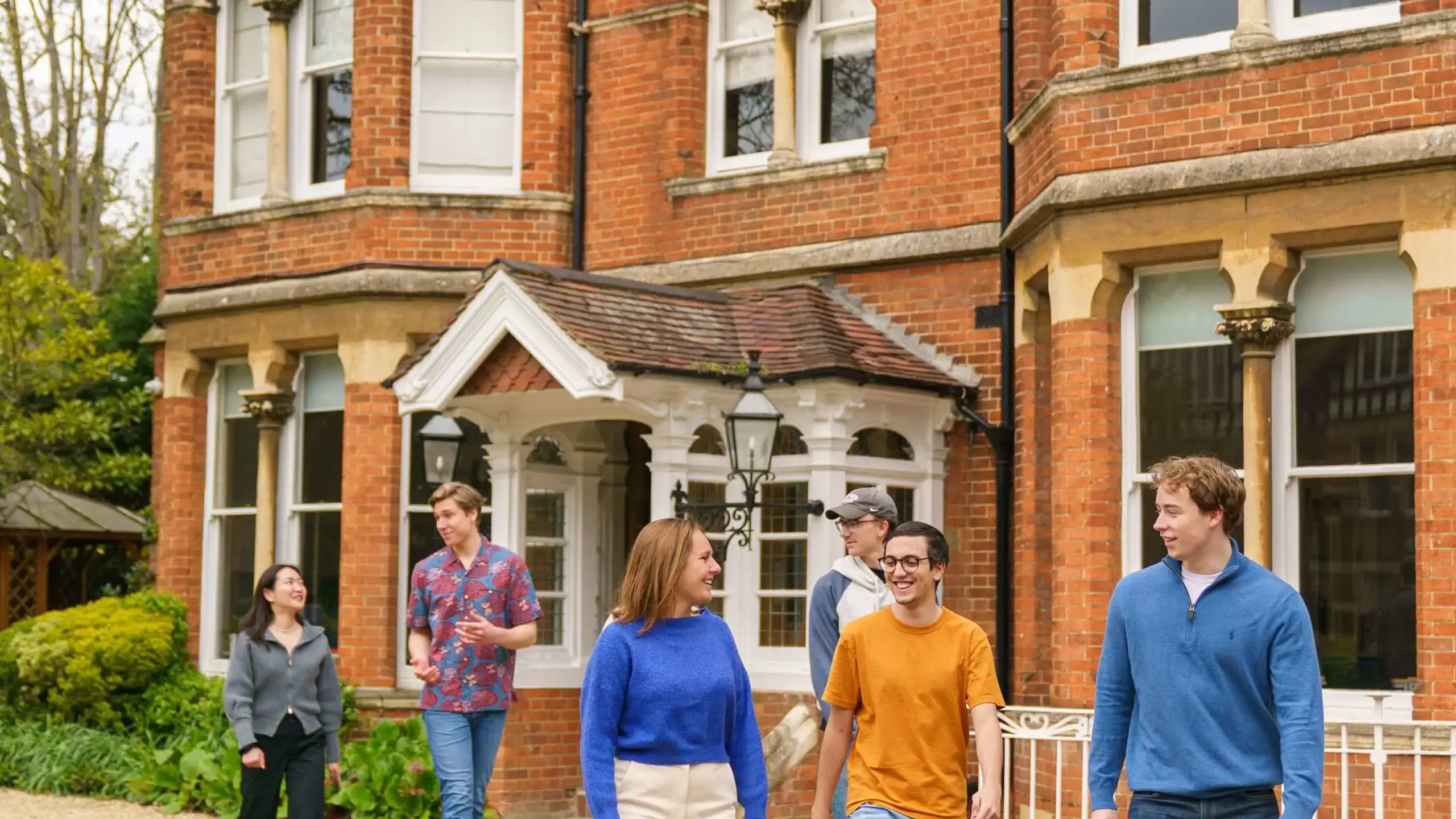 Students walking outside St Clare's building