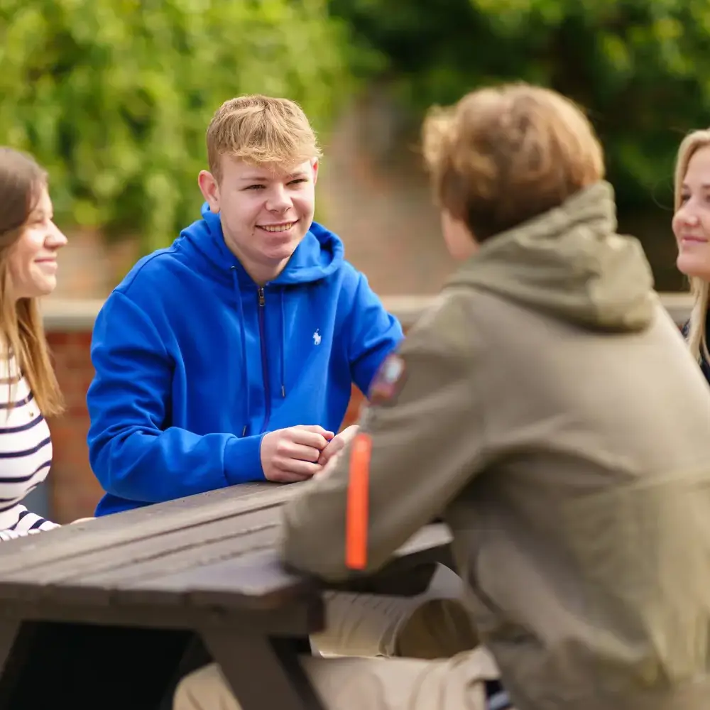 IC students sat at bench talking