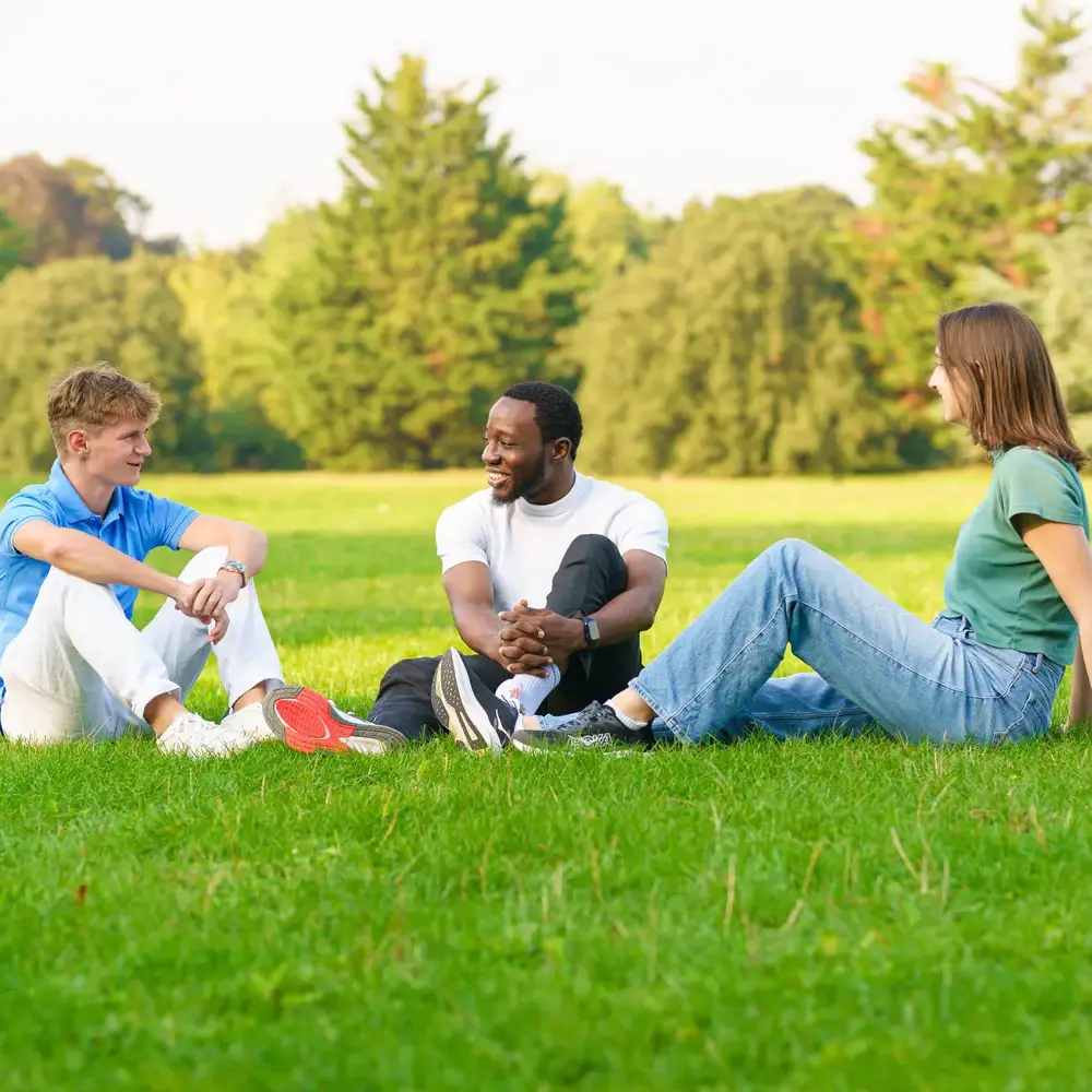 IC student sat in field chatting