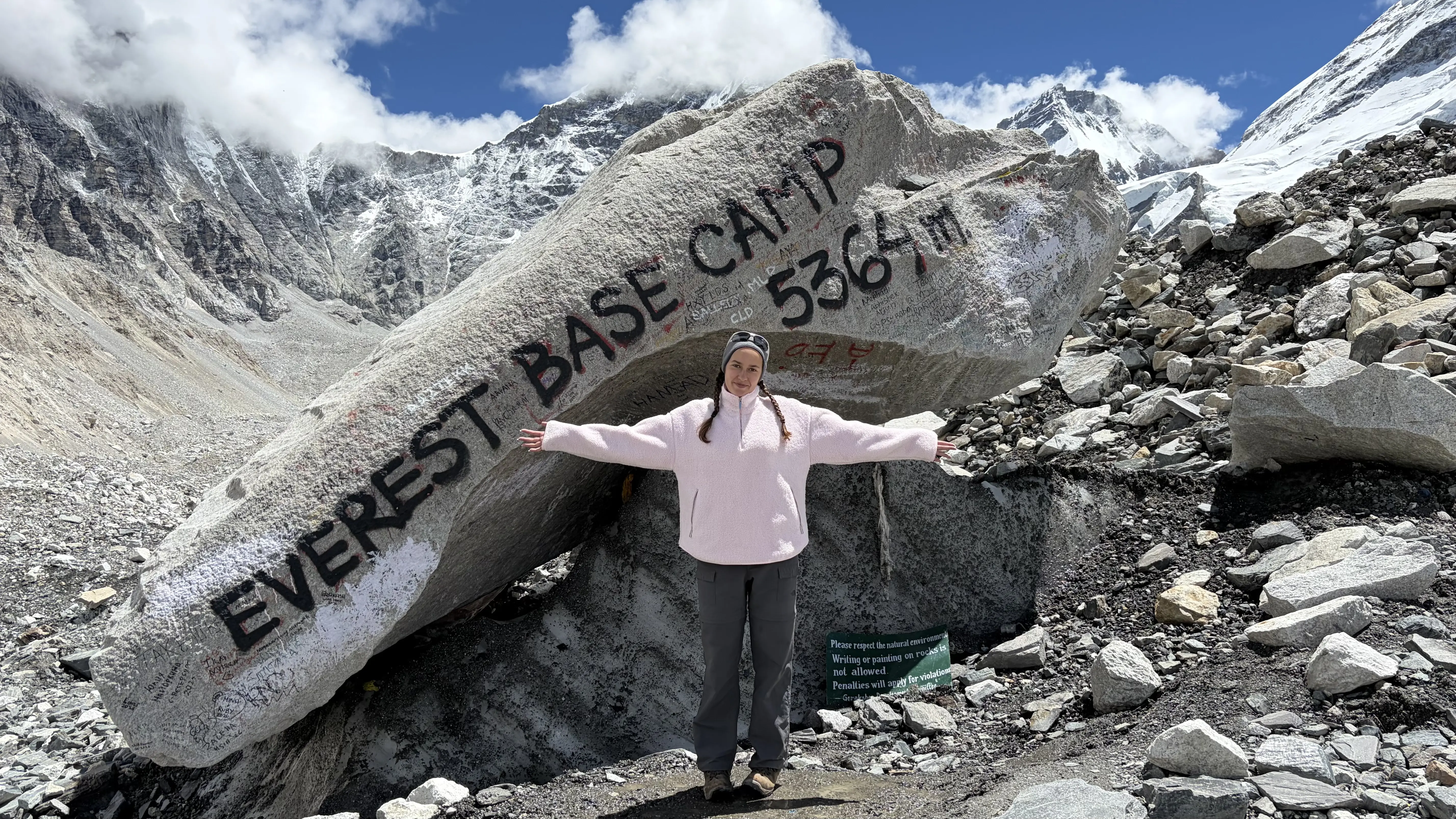 IB Alumna Emilia standing at Everest Base Camp in the Himalayas