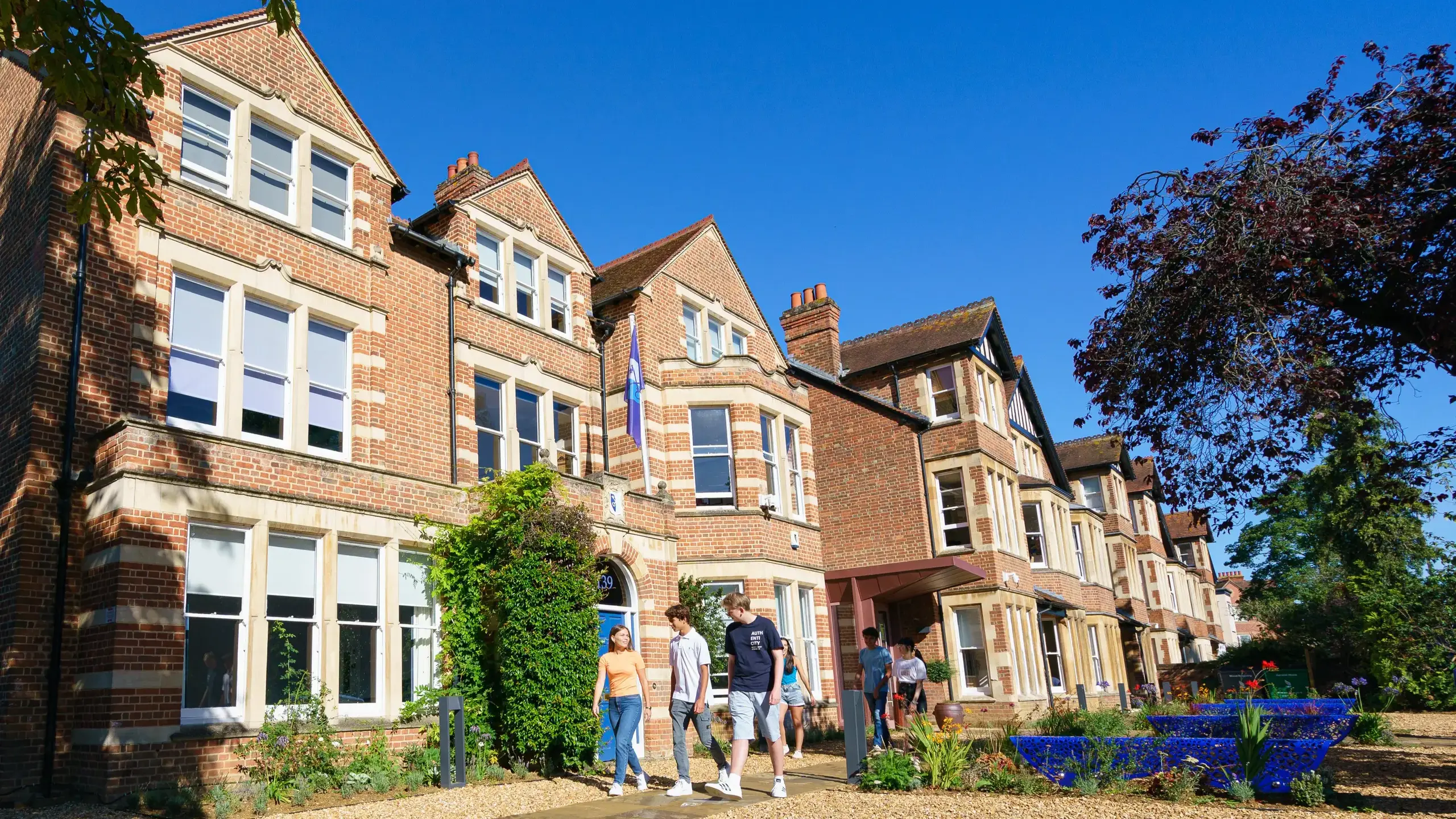 Students walking outside St Clare's building