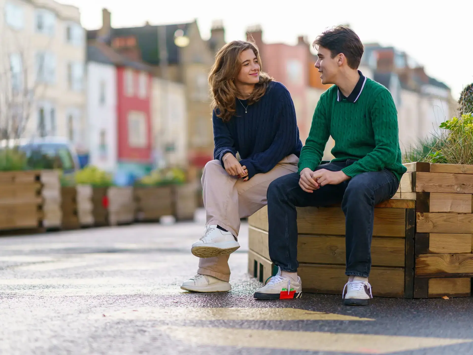 Students sat on bench in Oxford disussing
