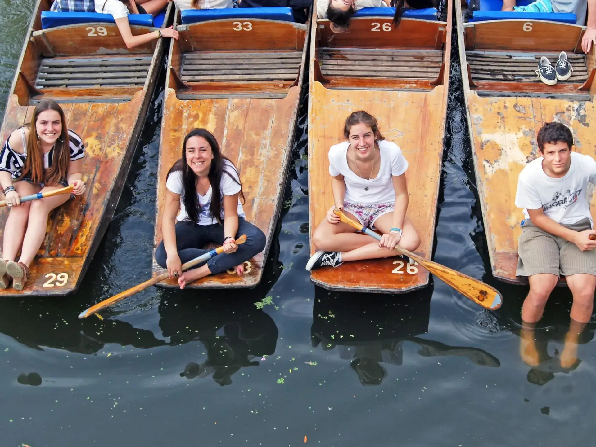 Students on canal boats smiling