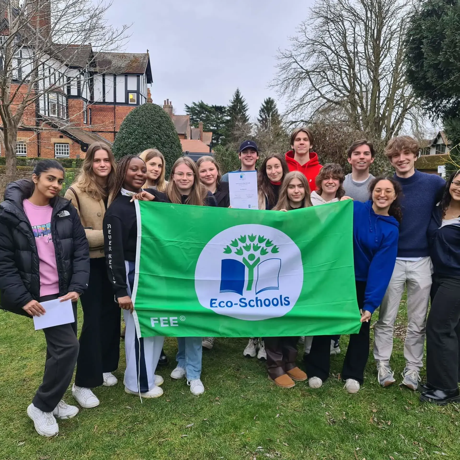 Students posing with Eco Schools banner