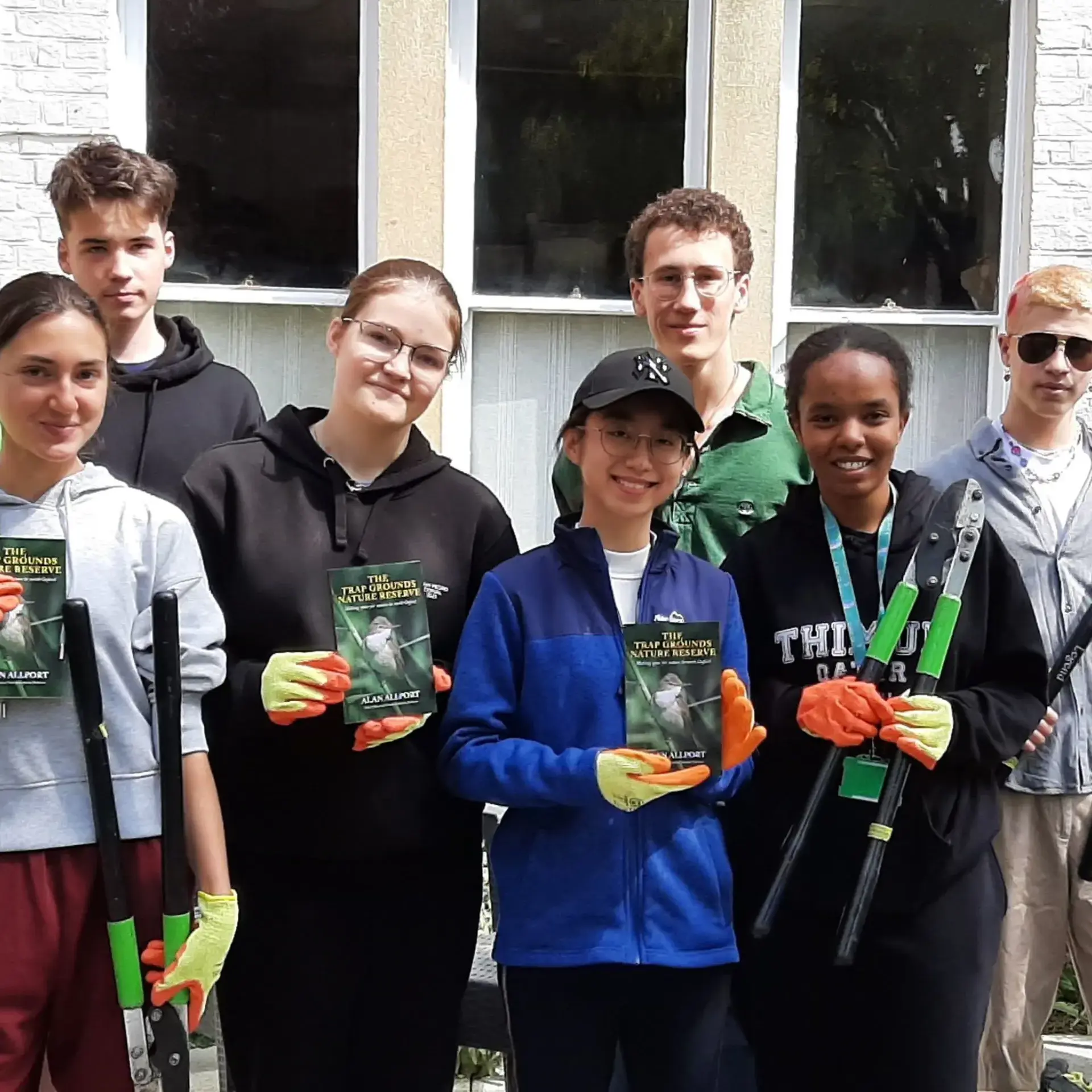 Students posing with nature awards