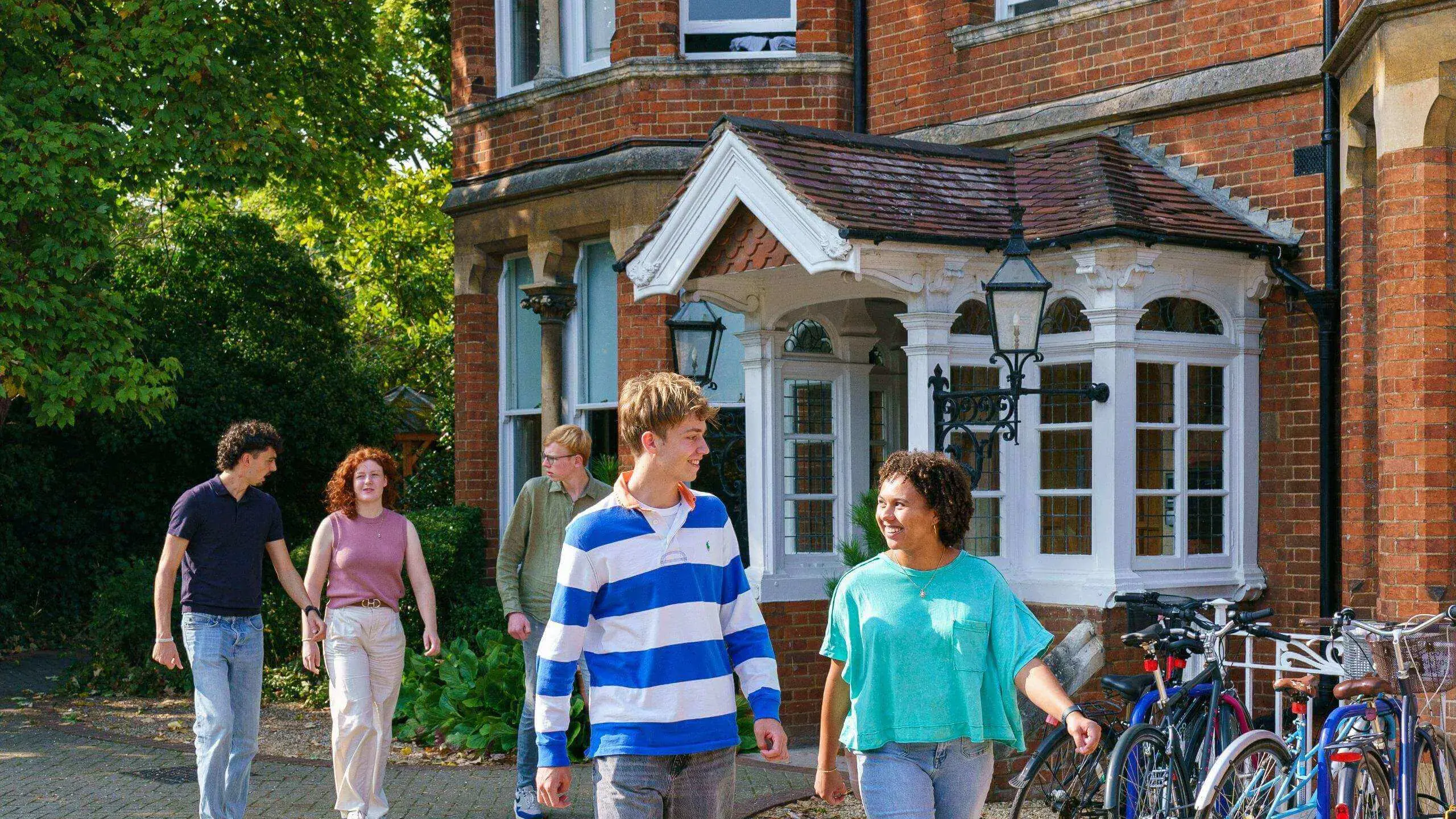 Students walking outside St Clare's building