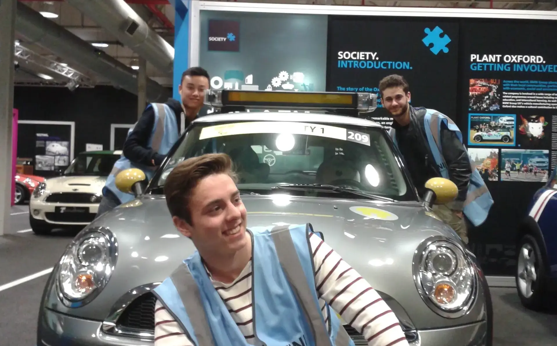 Students posing next to Mini