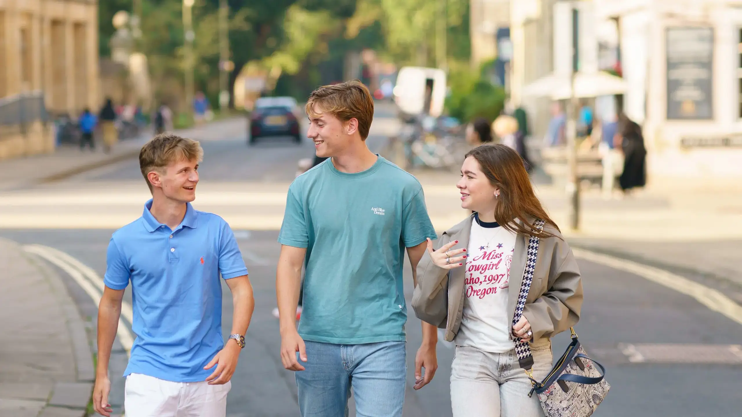 Three students walking through Oxford together