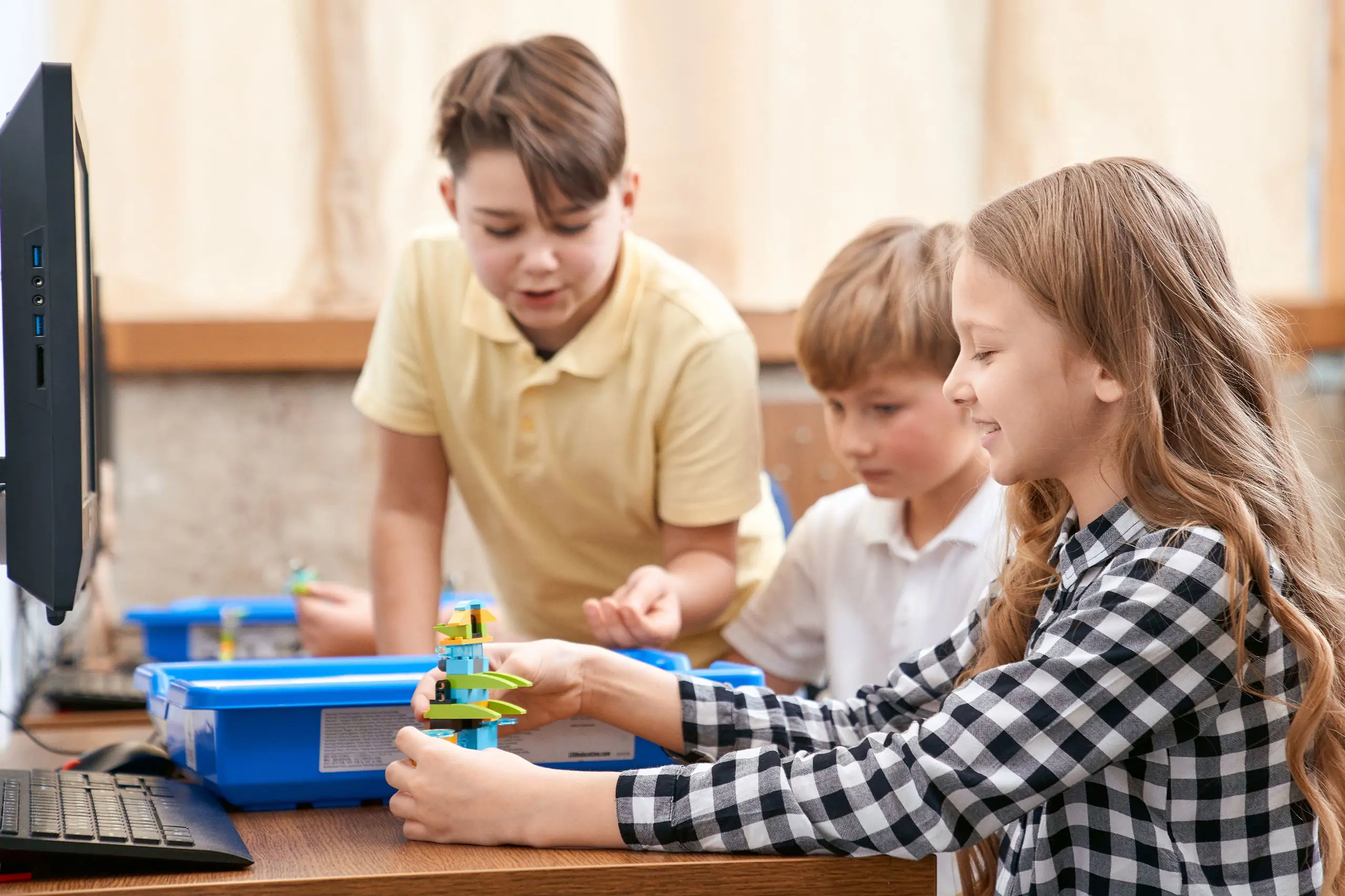 STEM students in class building with legos