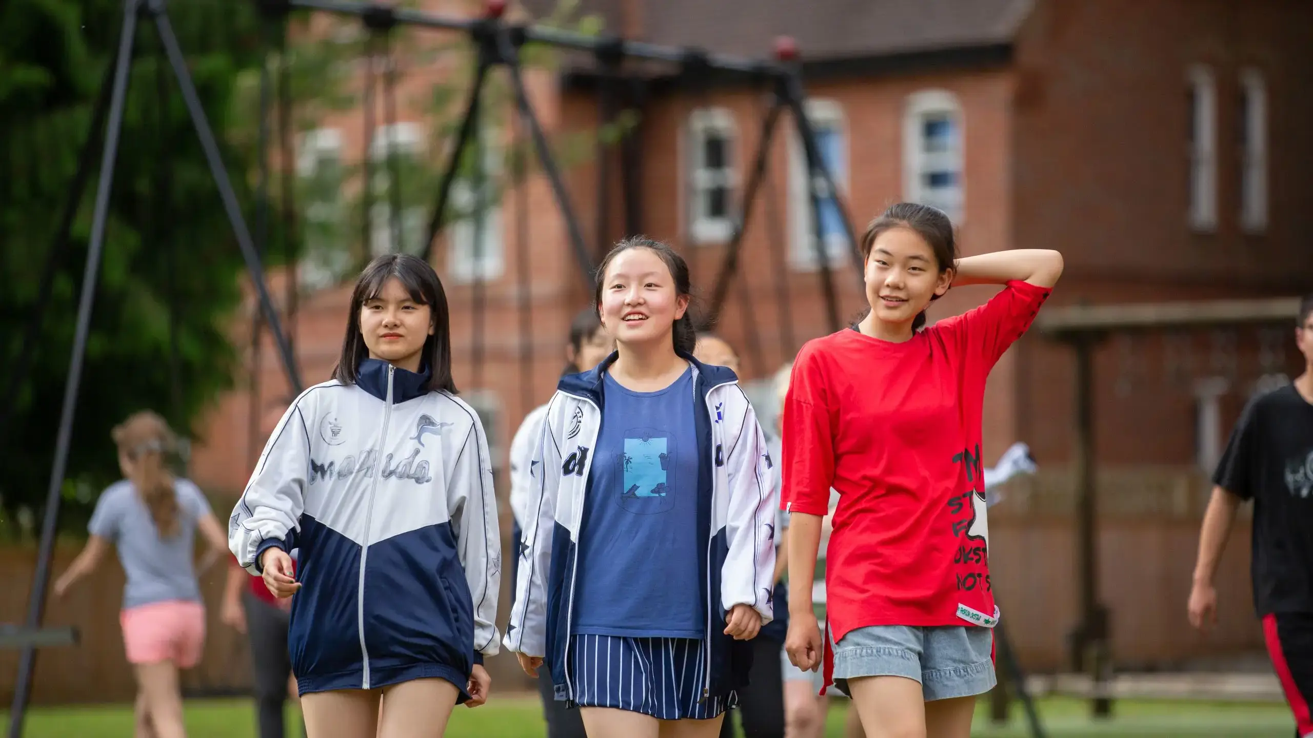 Three students walking together outside