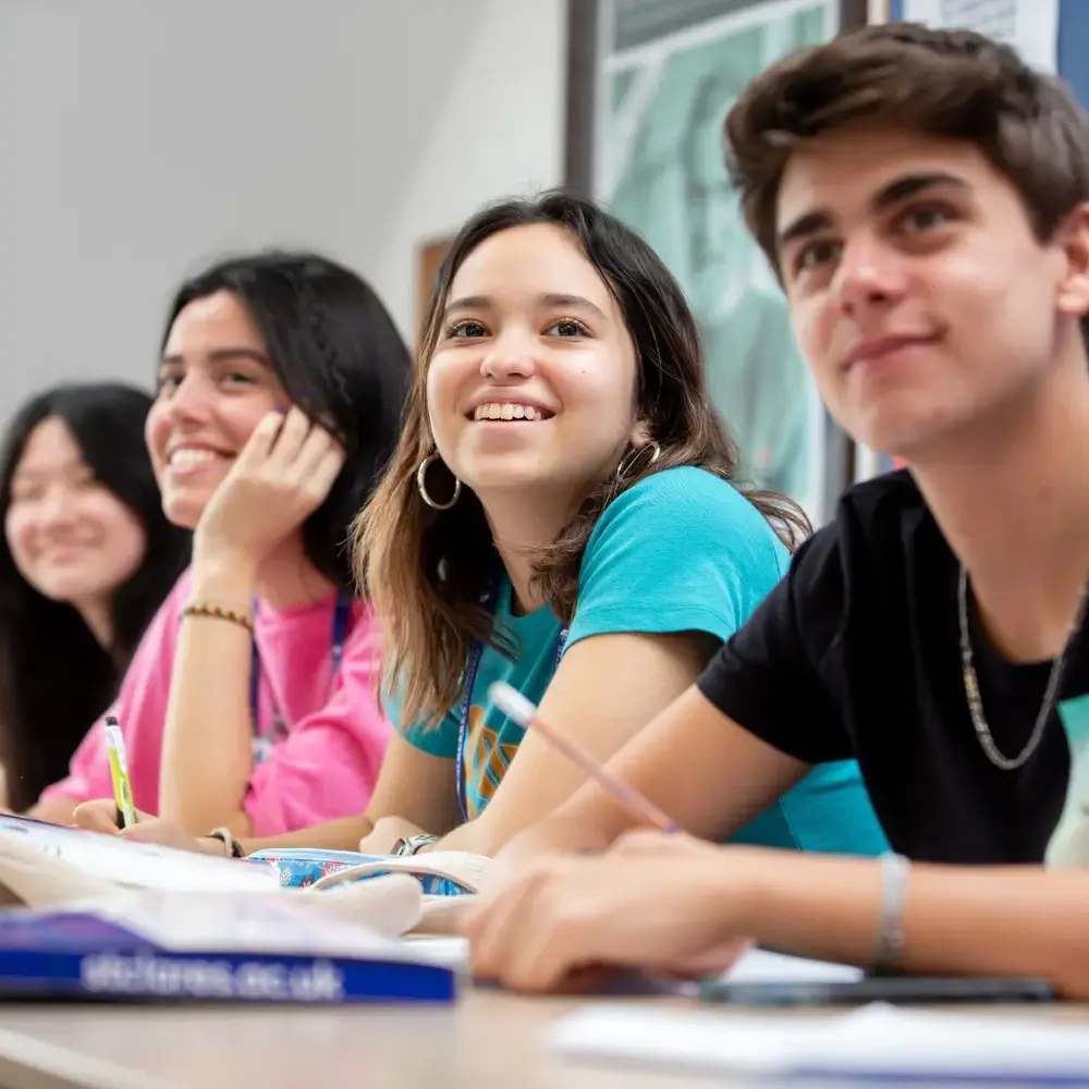Summer short course students in class smiling