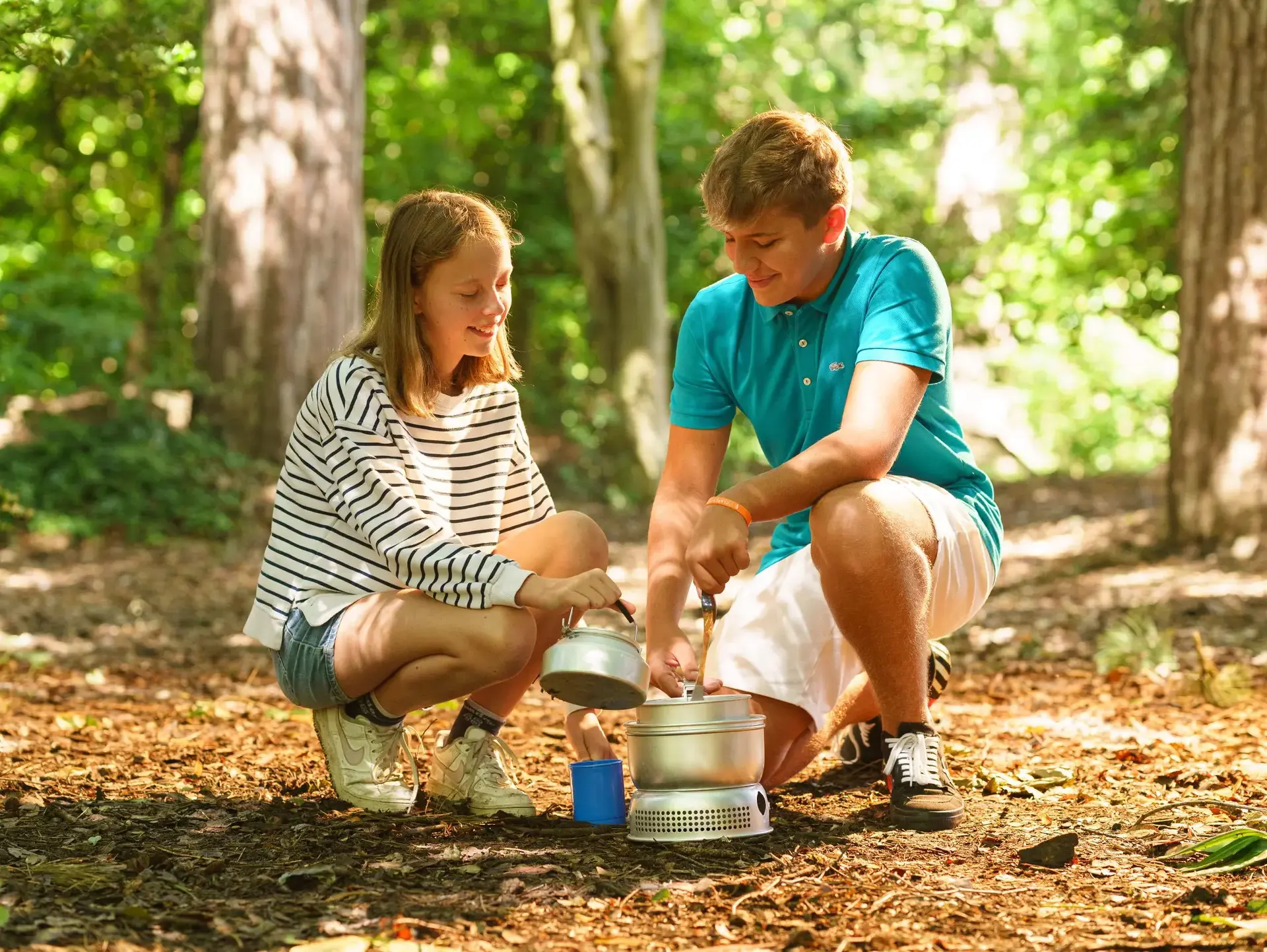 Students using camp kettle