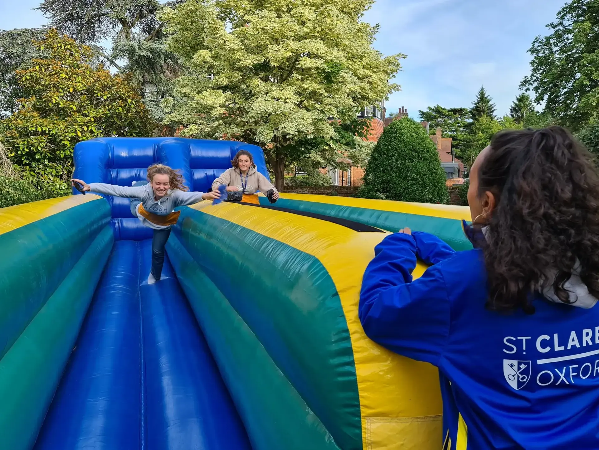 Students playing on inflatables