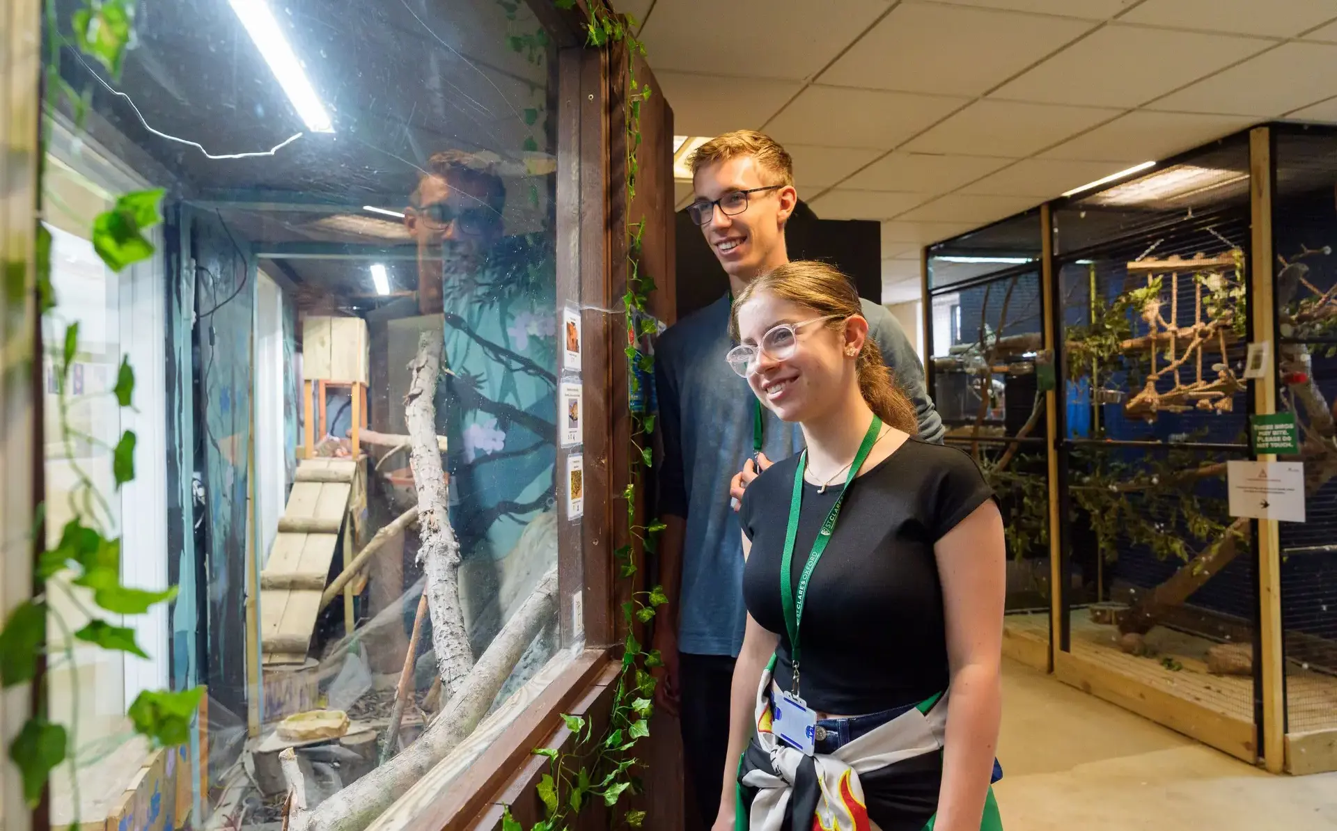 Students looking into exhibit glass