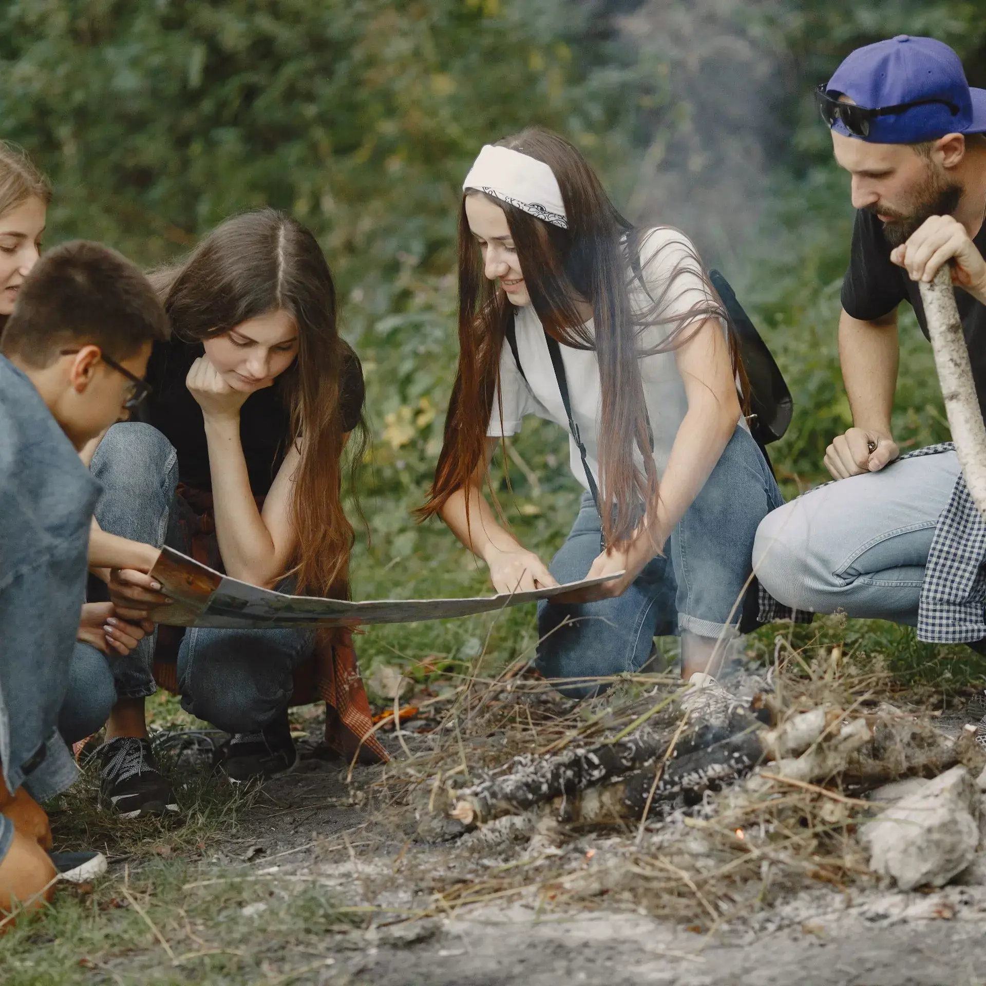 Students surrounding campfire