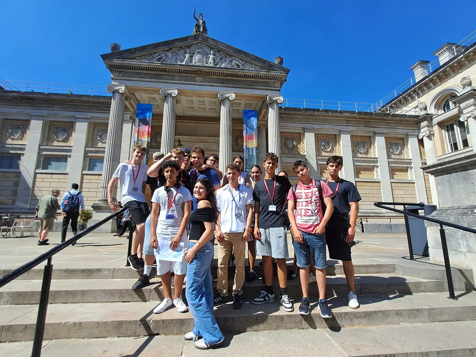 Students standing on footsteps of gallery building