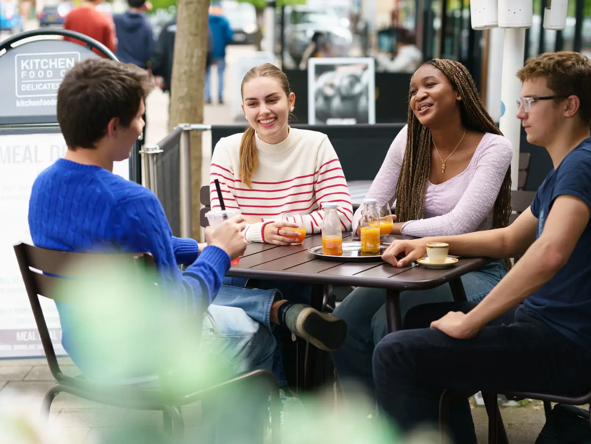 Students sitting outside cafe